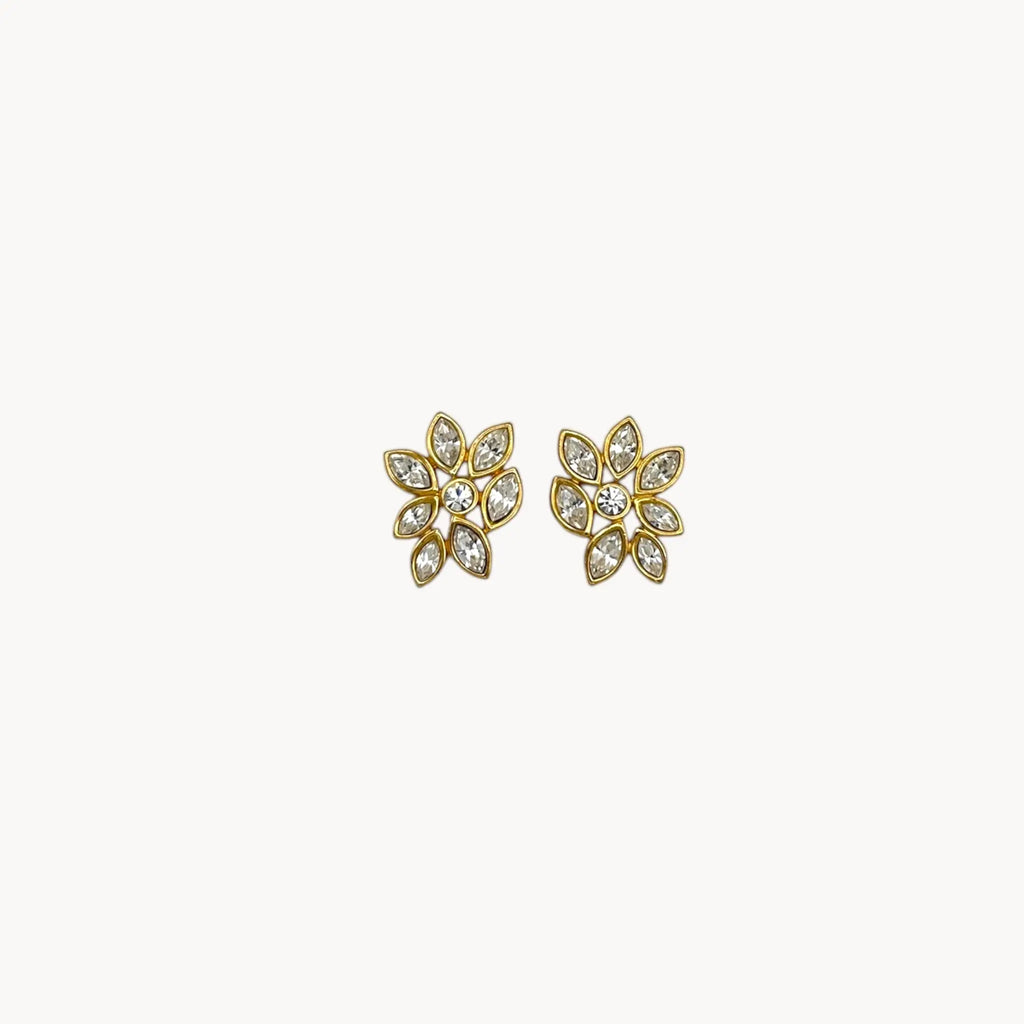 Monet vintage gold tone pierced earrings with clear marquise rhinestones arranged in a floral pattern, elegant 1980s bridal jewelry shown on white background.