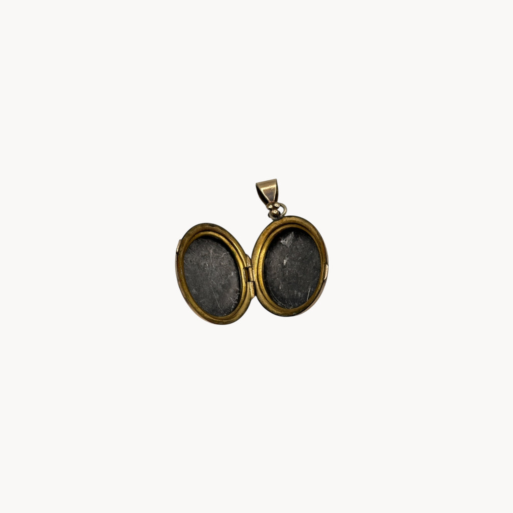 Open view Antique gold-filled etched floral locket with ornate border, Victorian keepsake pendant.