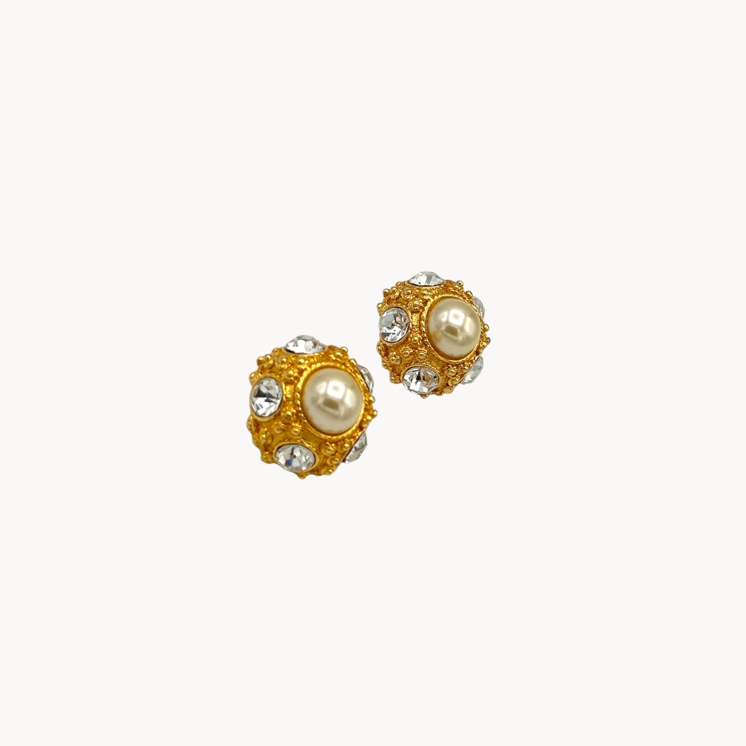 Side view of Vintage Blanca pearl and rhinestone gold-tone clip-on earrings.