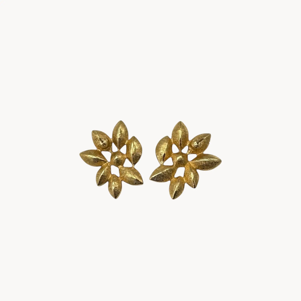 Back view of Monet vintage gold tone pierced earrings with clear marquise rhinestones arranged in a floral pattern, elegant 1980s bridal jewelry shown on white background.