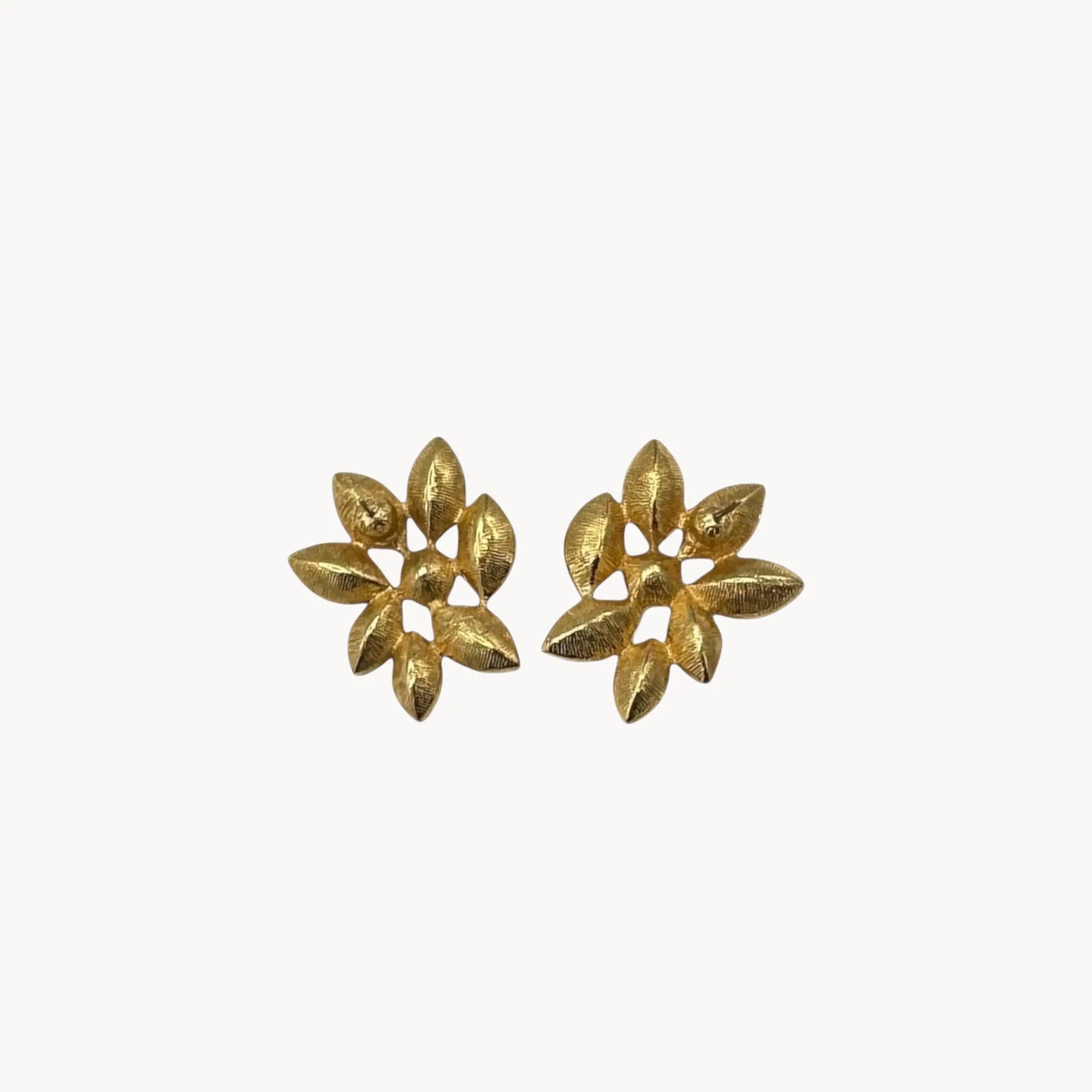 Back view of Monet vintage gold tone pierced earrings with clear marquise rhinestones arranged in a floral pattern, elegant 1980s bridal jewelry shown on white background.