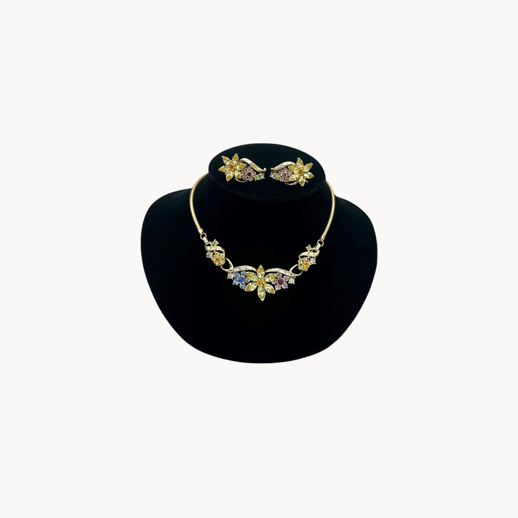 Vintage Coro multi-color rhinestone necklace and clip-on earring set with floral design.