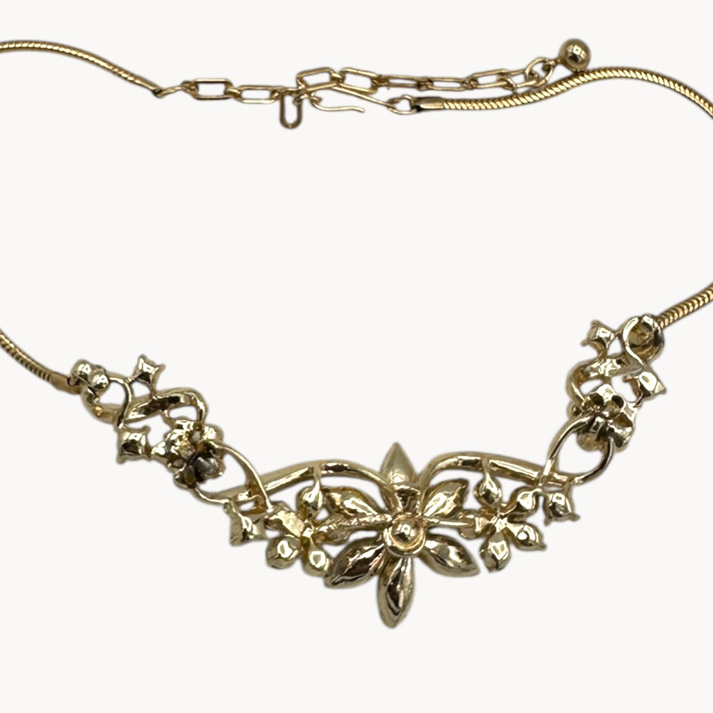 Back view of pendant of Vintage Coro multi-color rhinestone necklace and clip-on earring set with floral design