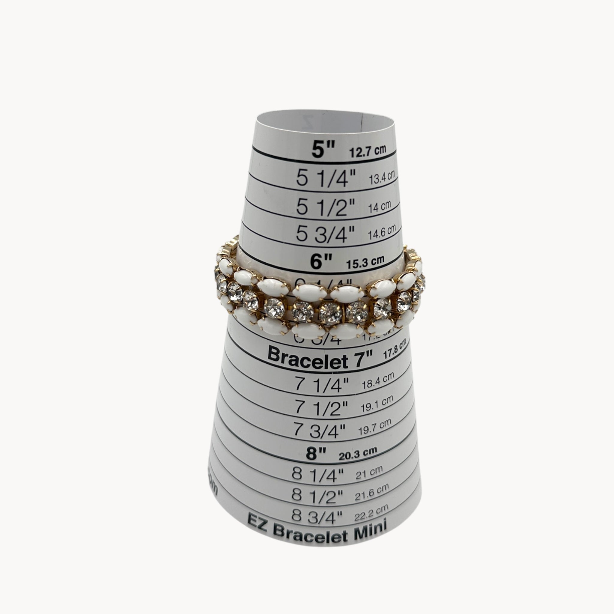 Size view of Mid-century Eisenberg bracelet with white milk glass and rhinestones, double-row design.
