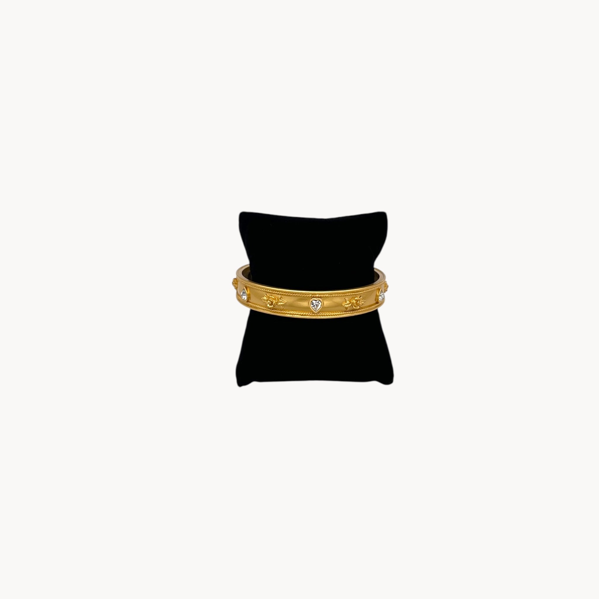 Elizabeth Taylor Love Blooms gold bangle bracelet with crystal heart and floral accents.