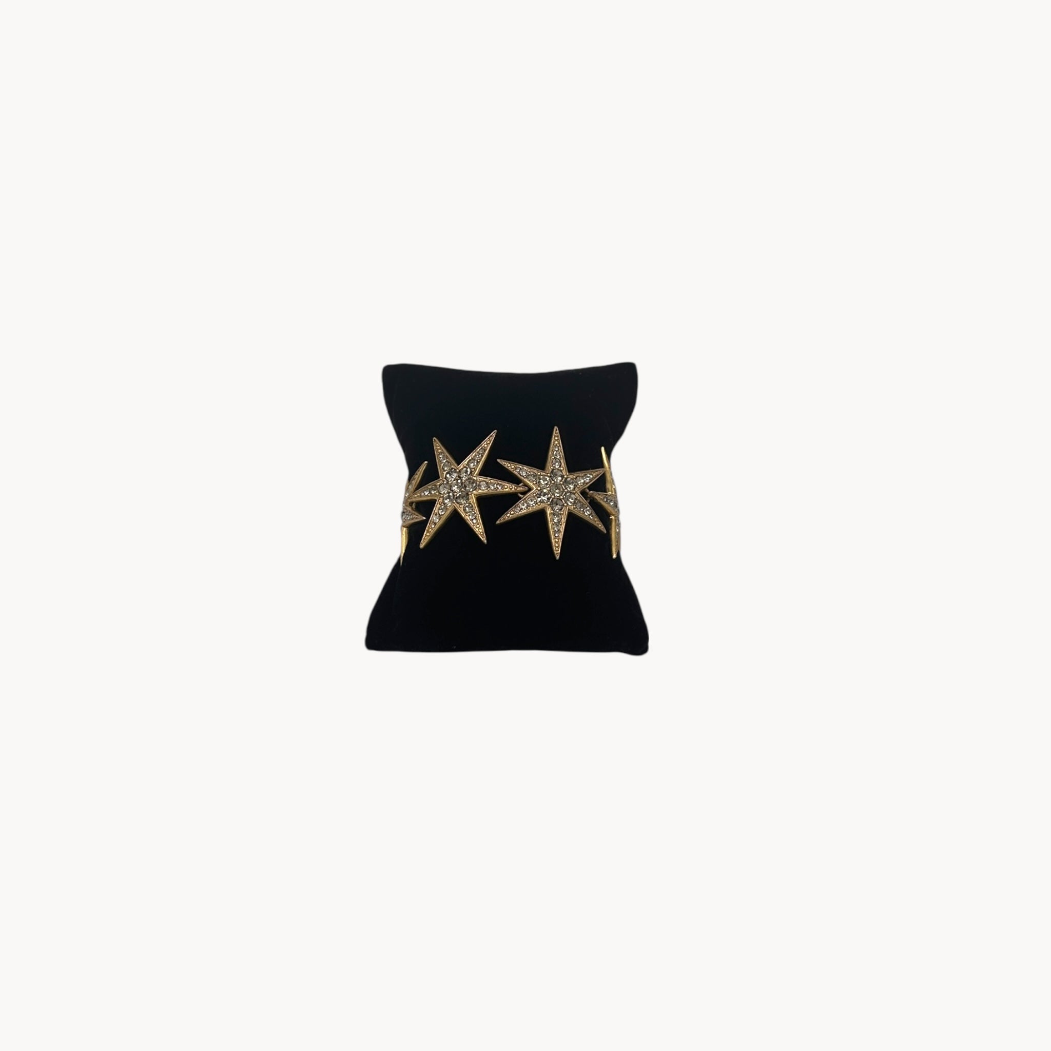 Front view of J. Crew gold-tone Art Deco style star bracelet with crystal accents.