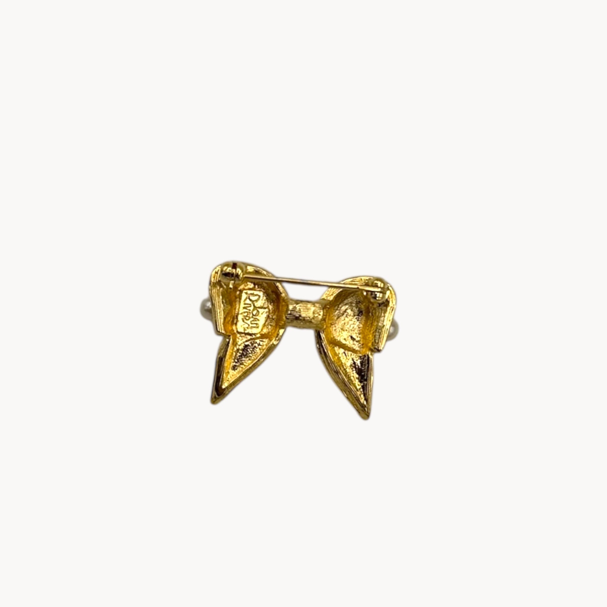 Back view of Joan Rivers gold-tone bow brooch with petite faux pearls, vintage jewelry.