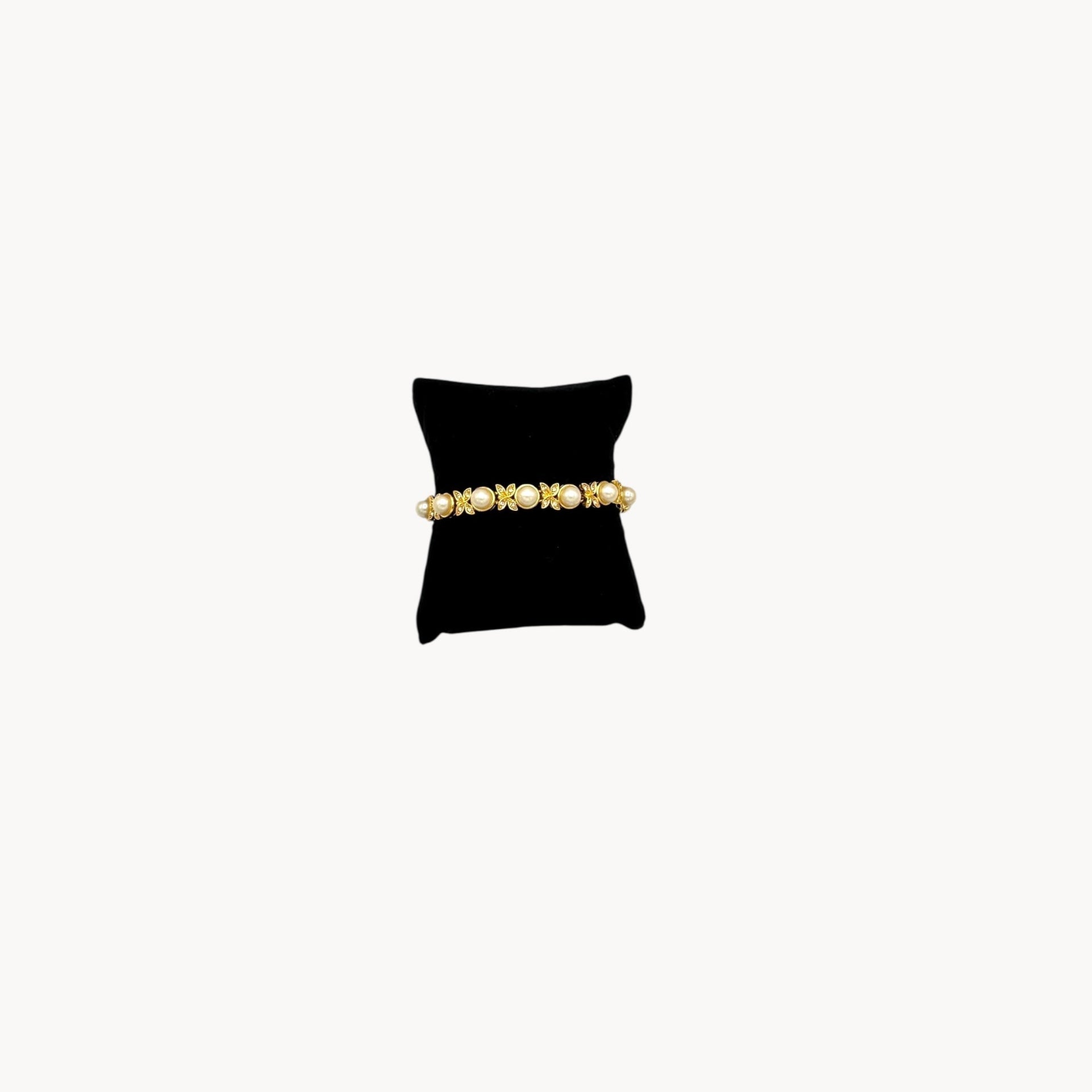 Joan Rivers gold bracelet with pearls and rhinestones.