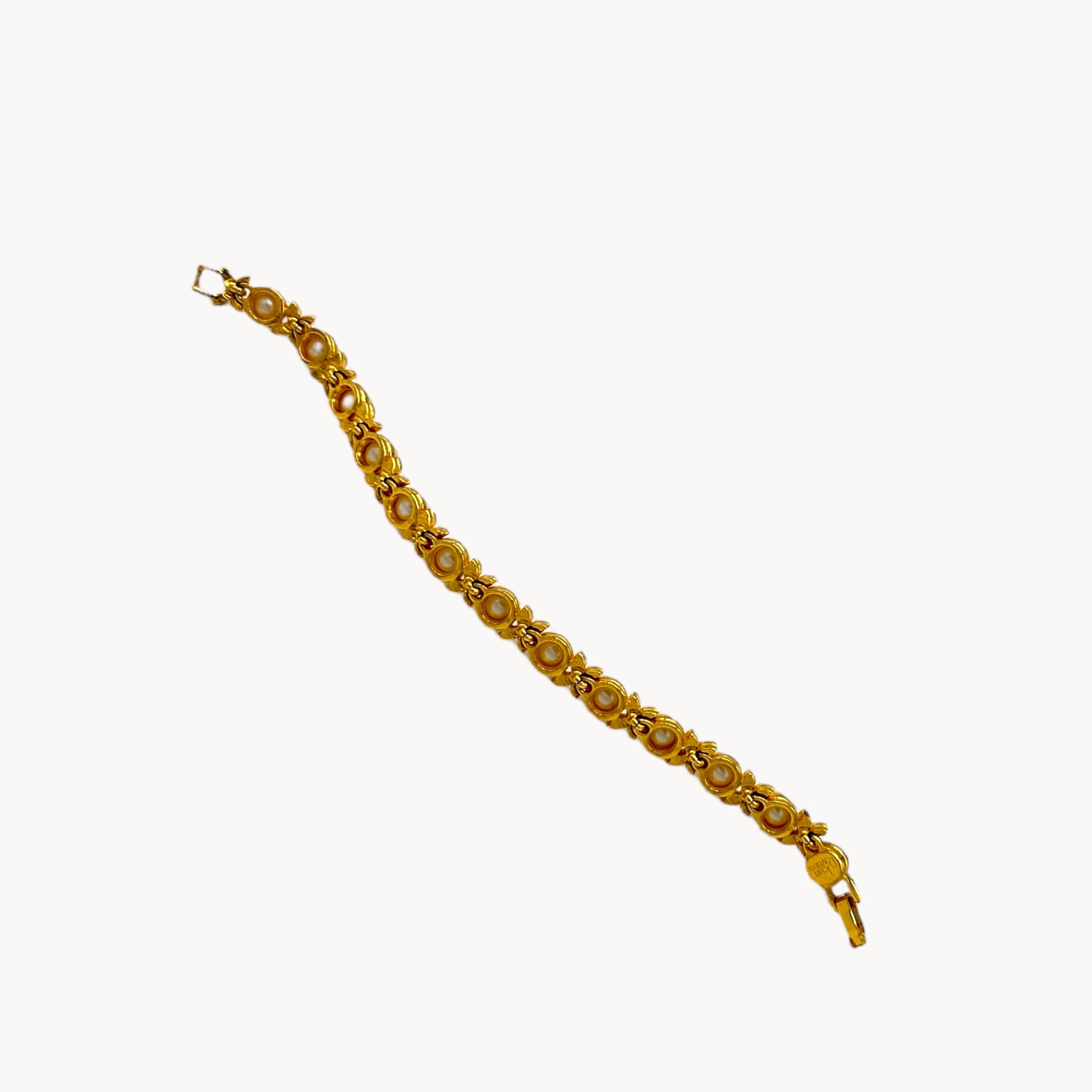 Back view of Joan Rivers gold bracelet with pearls and rhinestones.