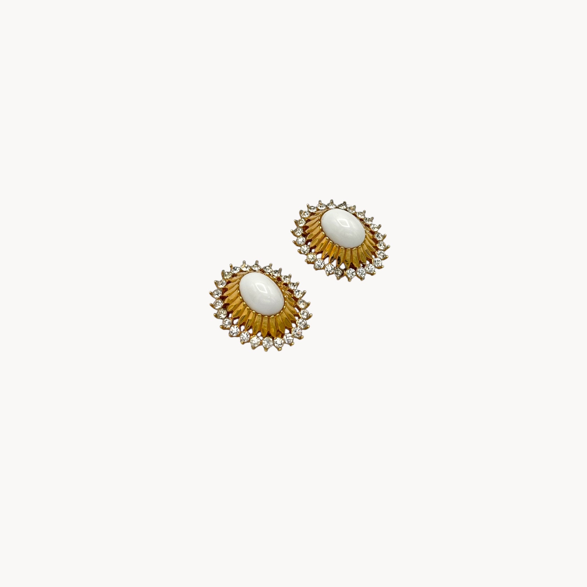 Side view of Gold Joseph Mazer Jomaz White Cabochon & Rhinestone Earrings shown on white background.