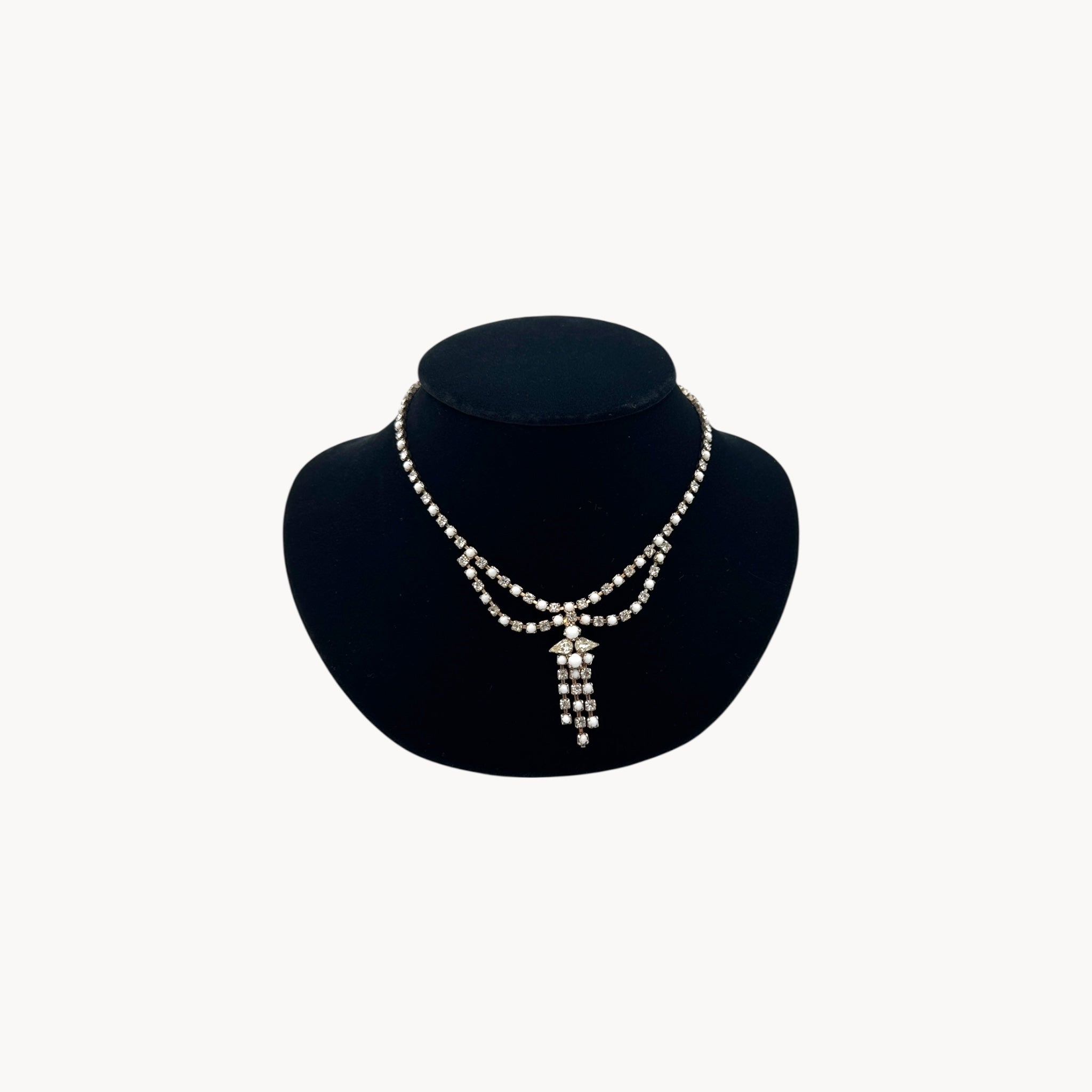 Vintage mid-century rhinestone and milk glass draped necklace with pendant drop.