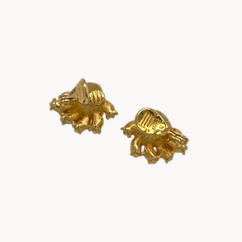 Back view of earring of Vintage Monet gold necklace and clip-on earring set with clear heart and pink rhinestones.