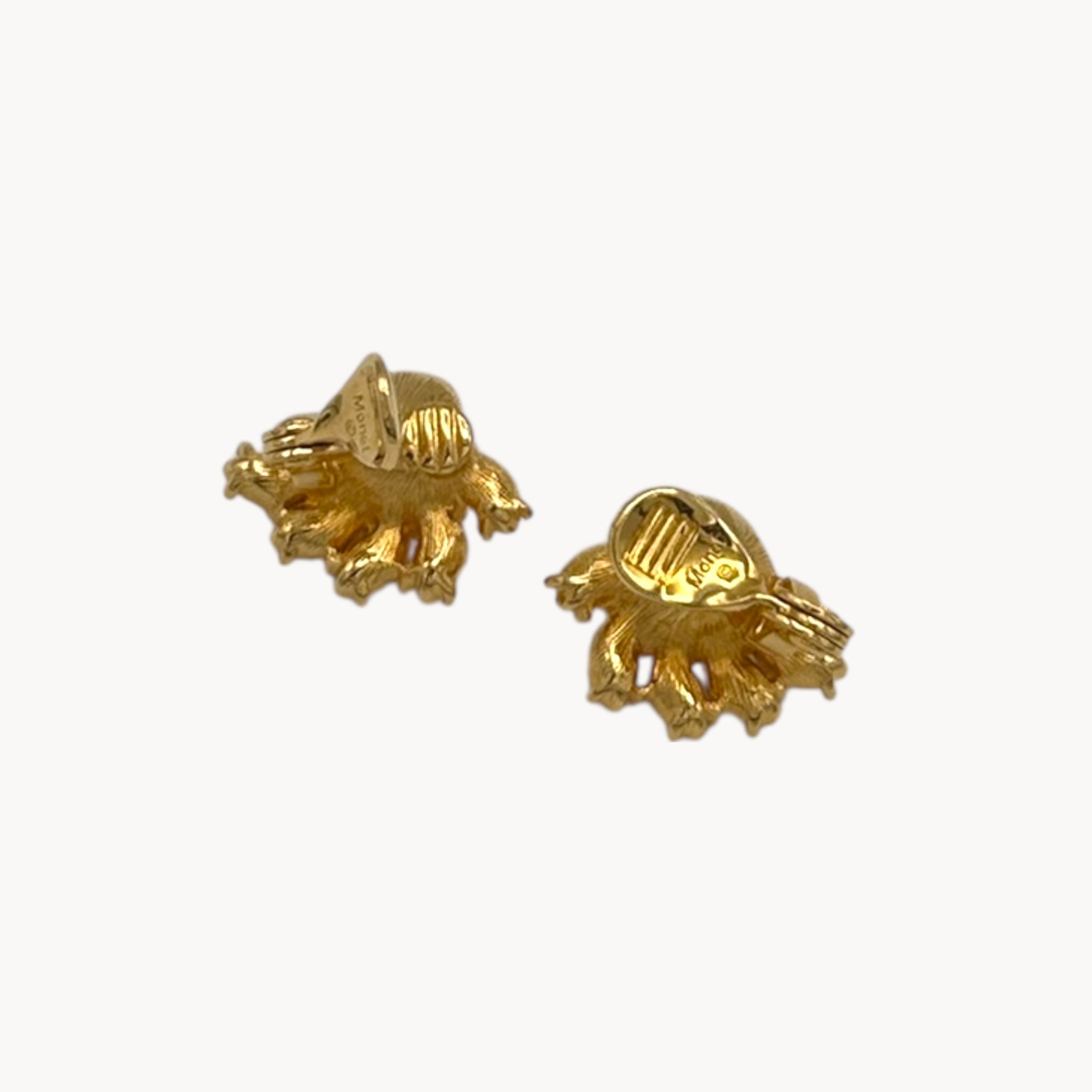 Back view of earring of Vintage Monet gold necklace and clip-on earring set with clear heart and pink rhinestones.