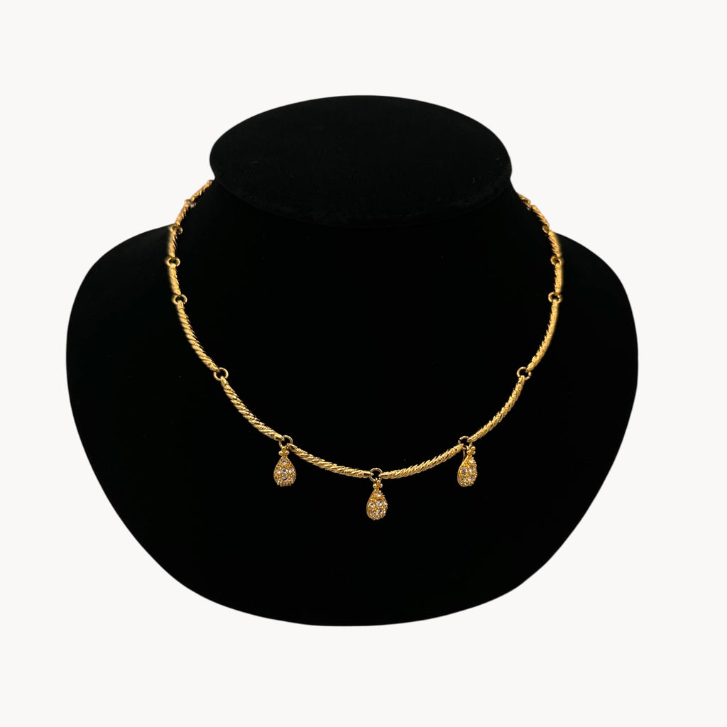 Close up view Nolan Miller gold adjustable necklace with removable rhinestone teardrop dangles, vintage bridal jewelry.