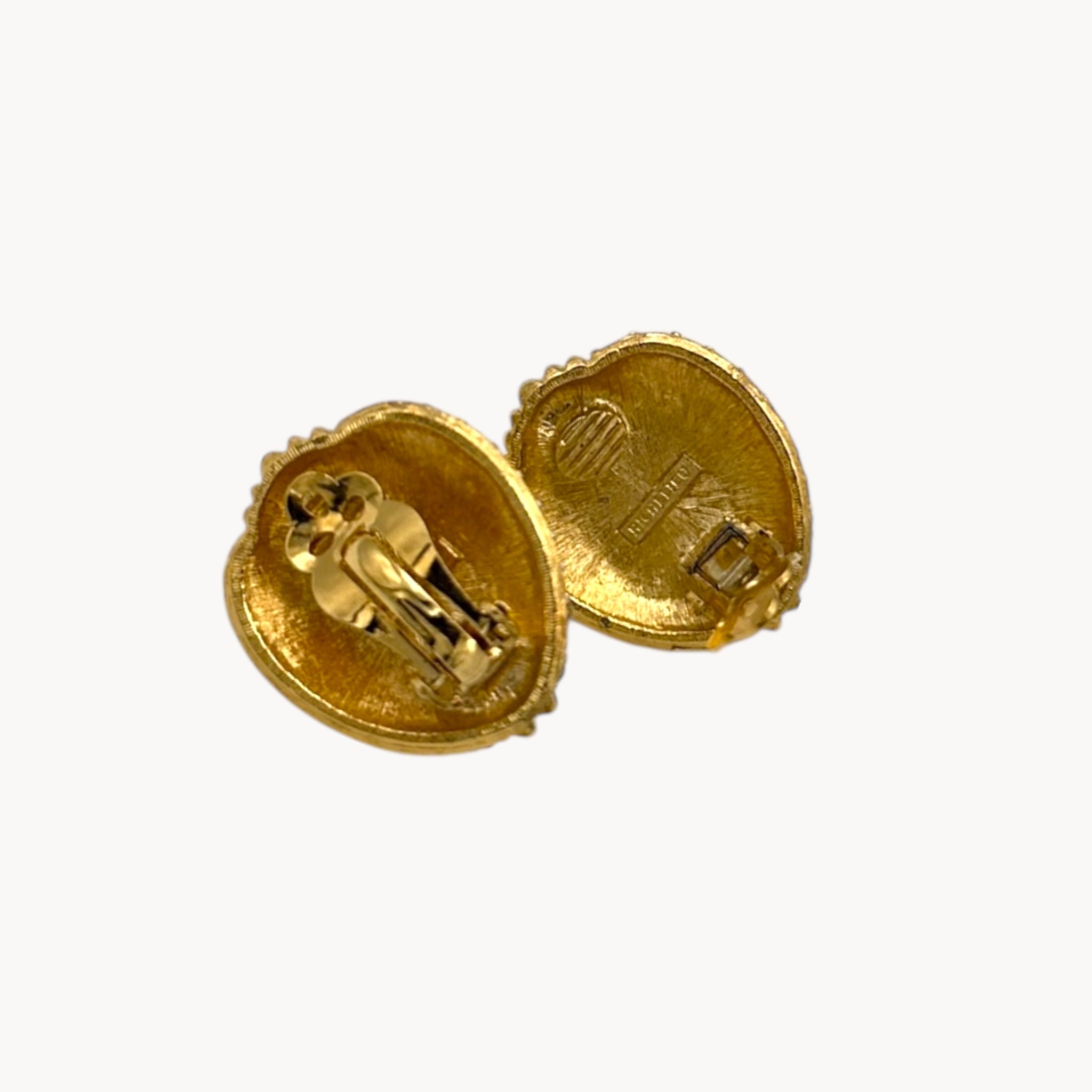 Back view of Richelieu gold-tone faux pearl clip-on earrings with rhinestone accents, vintage jewelry on white background.