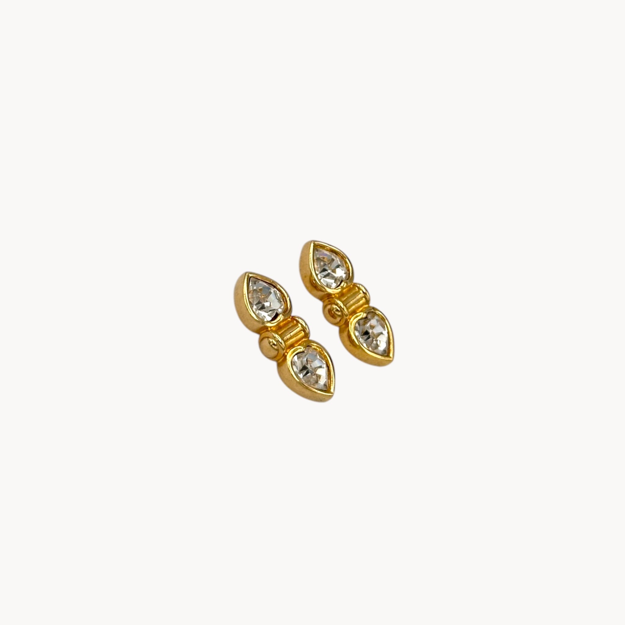 Side view of Vintage Swarovski SAL clear double heart rhinestone pierced earrings.
