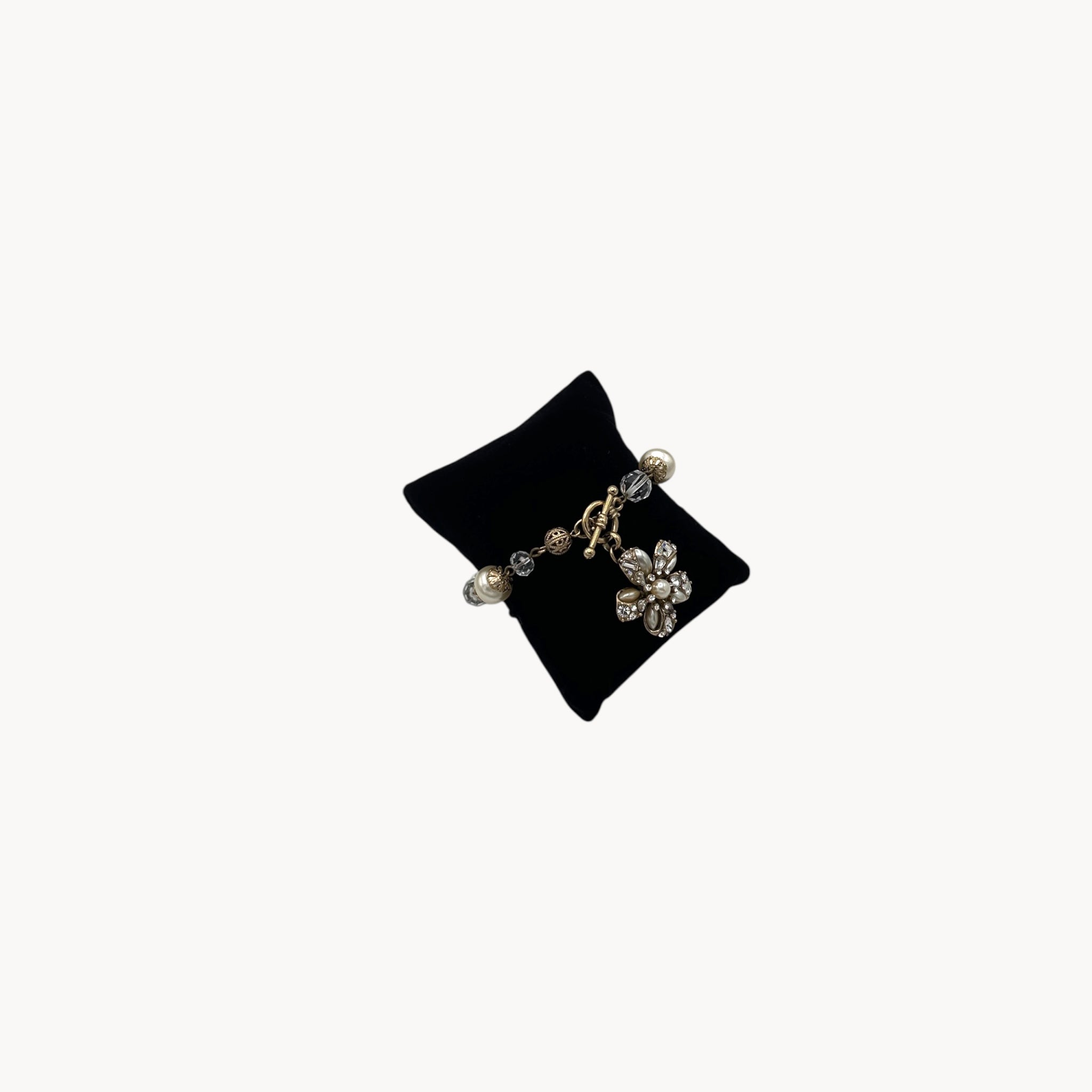 Right side view of Sweet Romance floral charm bracelet with pearls and rhinestones