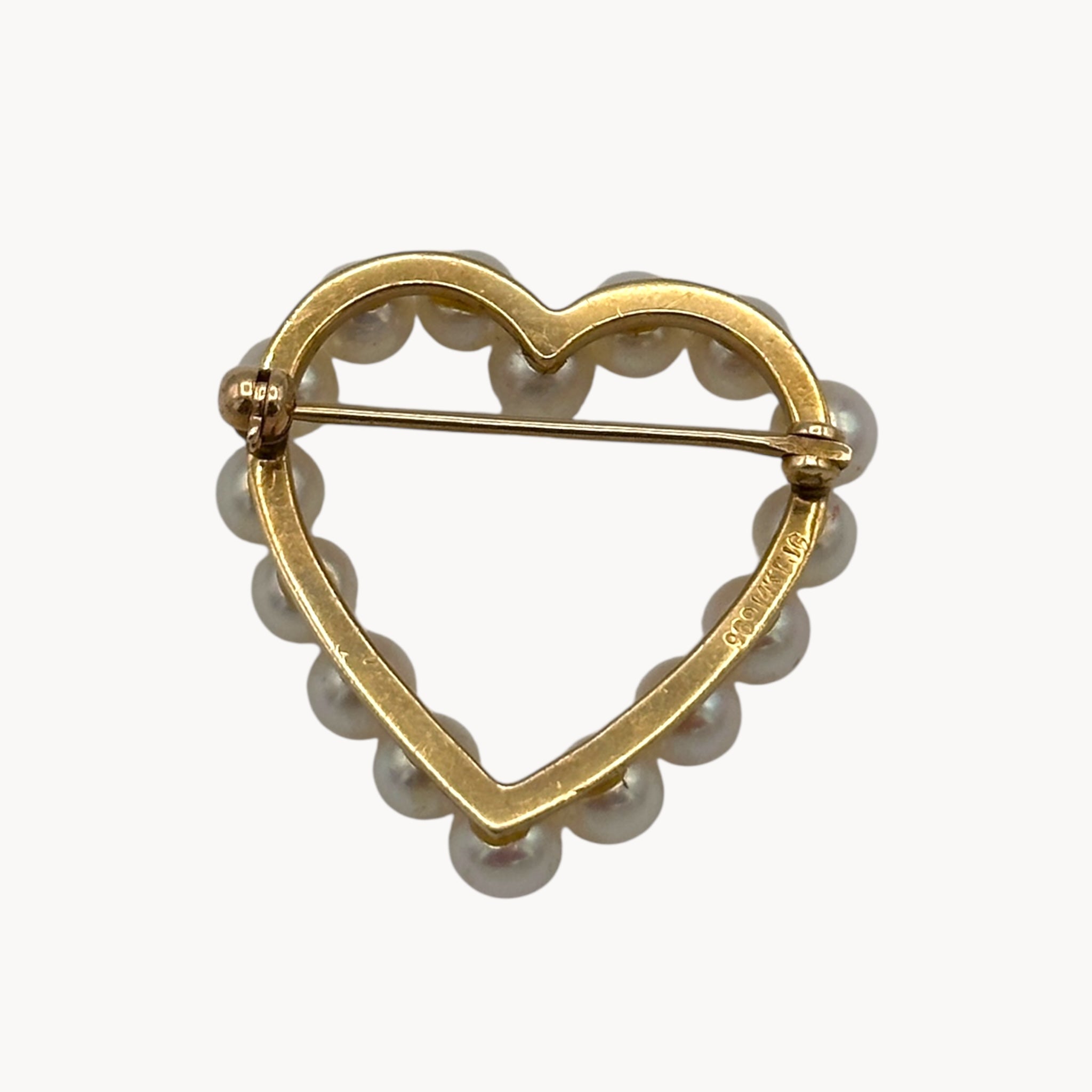 Close up view of back of Vintage 14K gold heart brooch with cultured pearls in a romantic design.