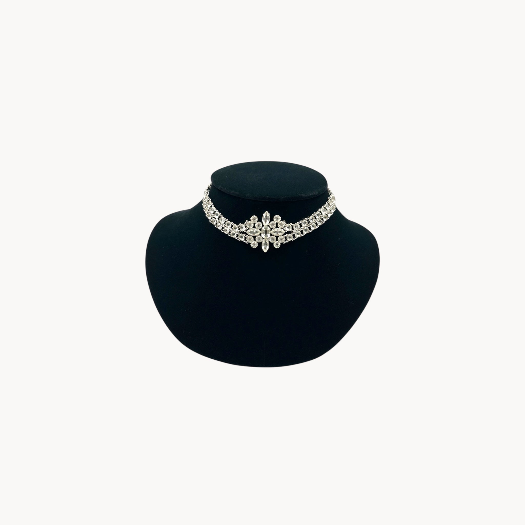 Art Deco crystal necklace on black bust.