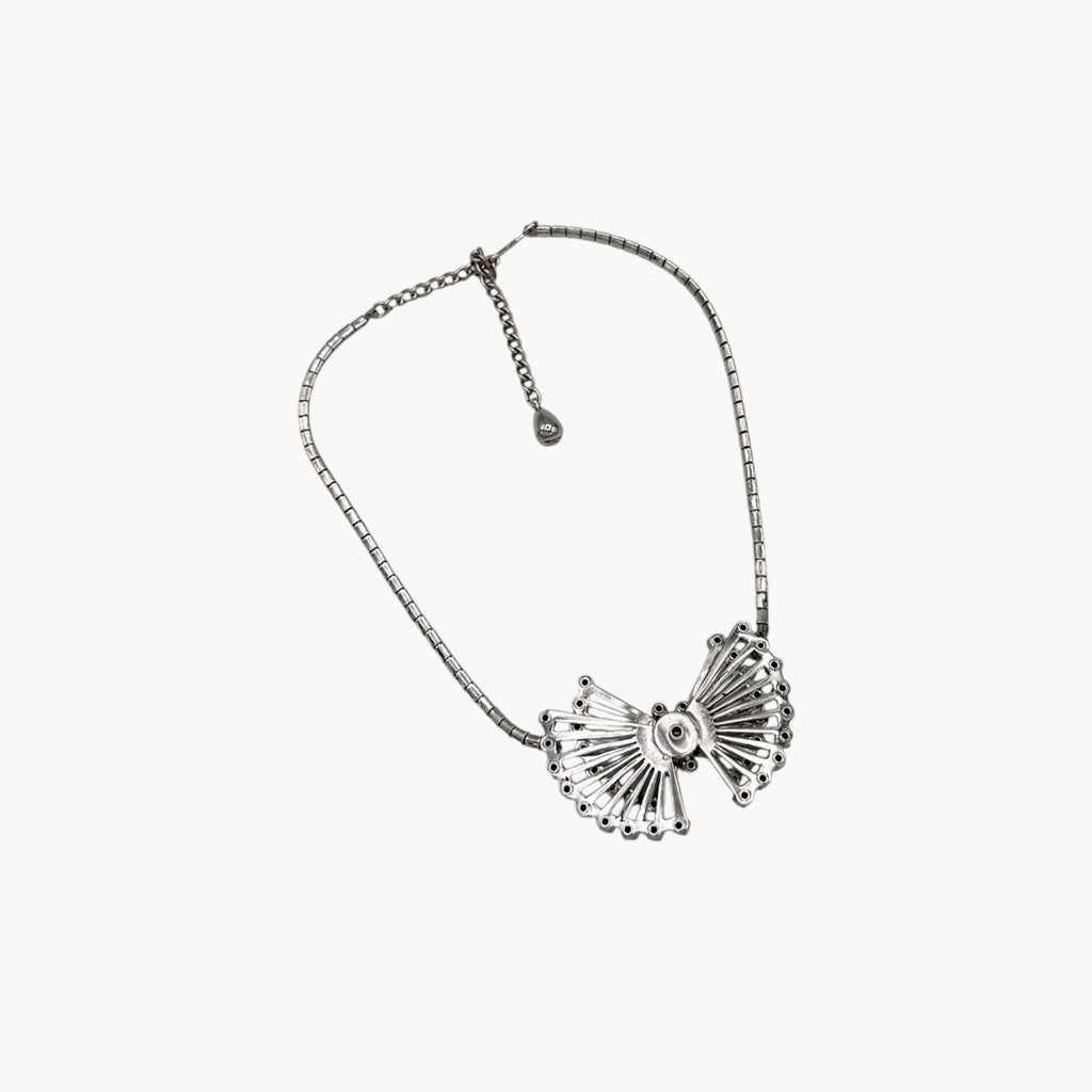Back view of Vintage 1950s silver plated rhinestone necklace with statement bow design, mid-century bridal jewelry.