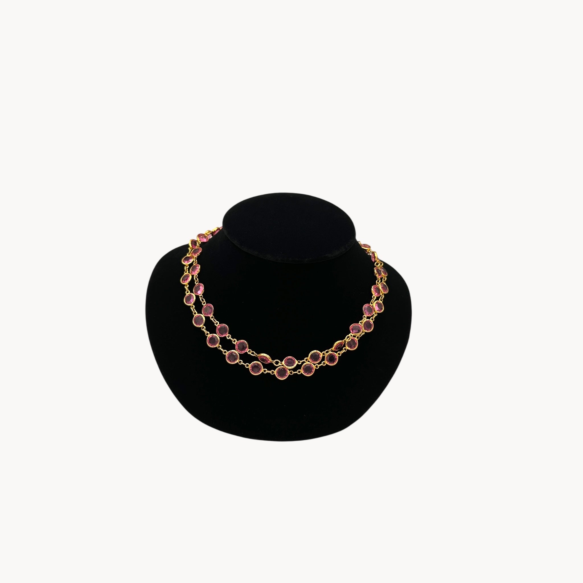 Vintage Austrian pink crystal bezel-set long necklace with gold-tone chain, 1970s–1980s bridal or evening jewelry should doubled on black bust.