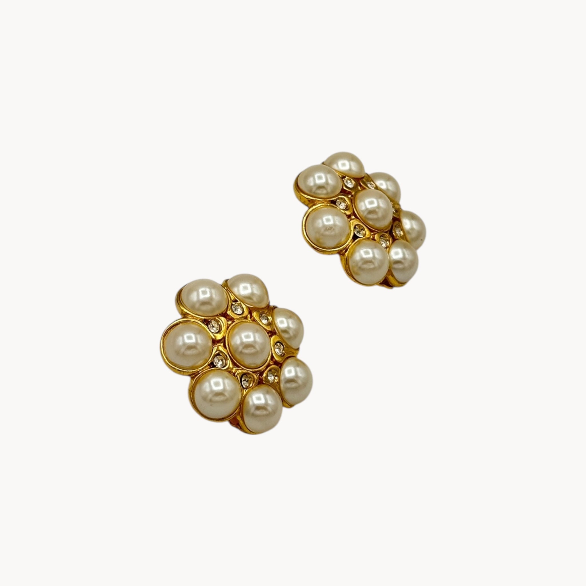 side view Vintage Blanca clip-on earrings with faux pearl cluster and crystal accents in floral design, 1980s–1990s bridal jewelry.