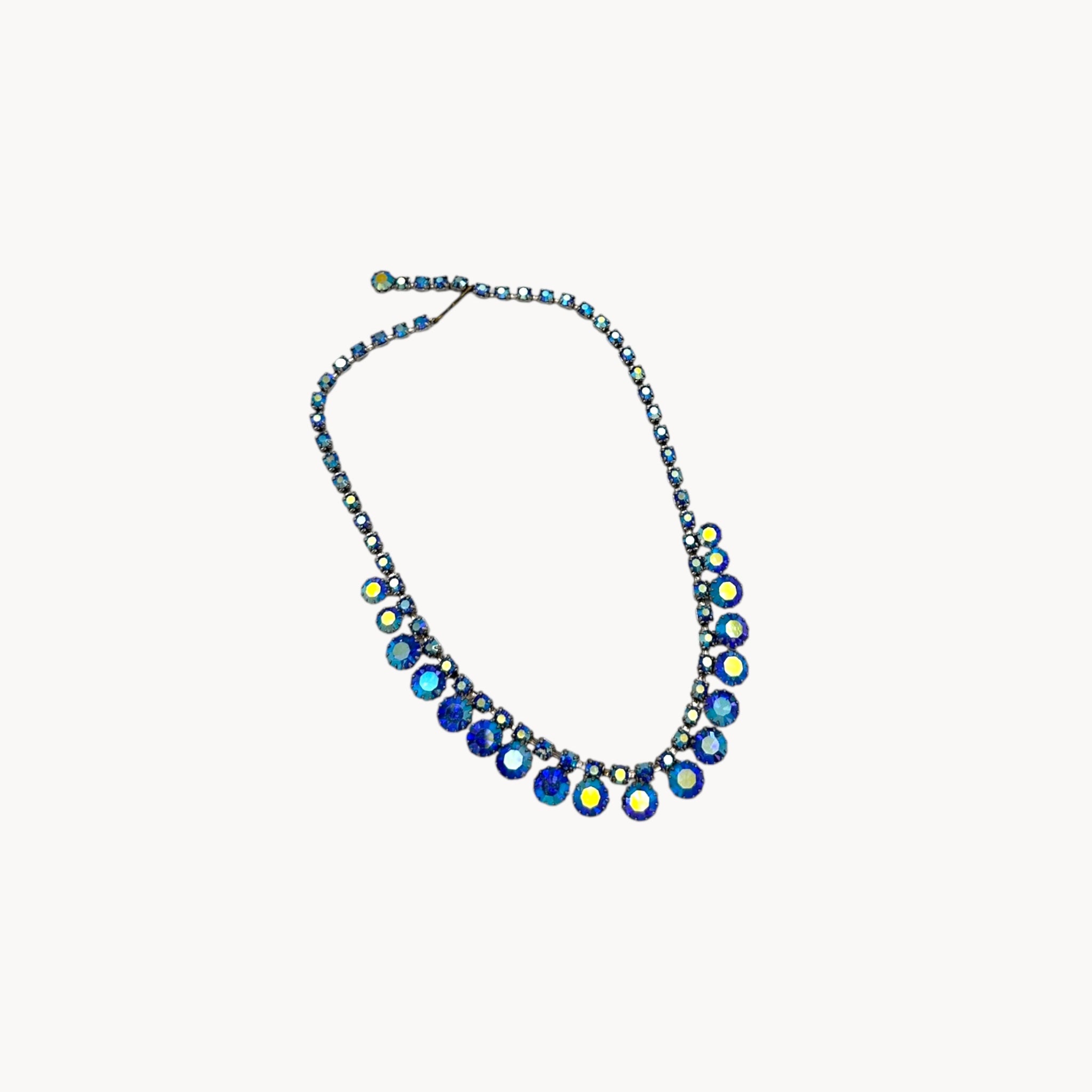 On white “Vintage unmarked blue aurora borealis rhinestone necklace, 1950s–1960s mid-century bridal jewelry.