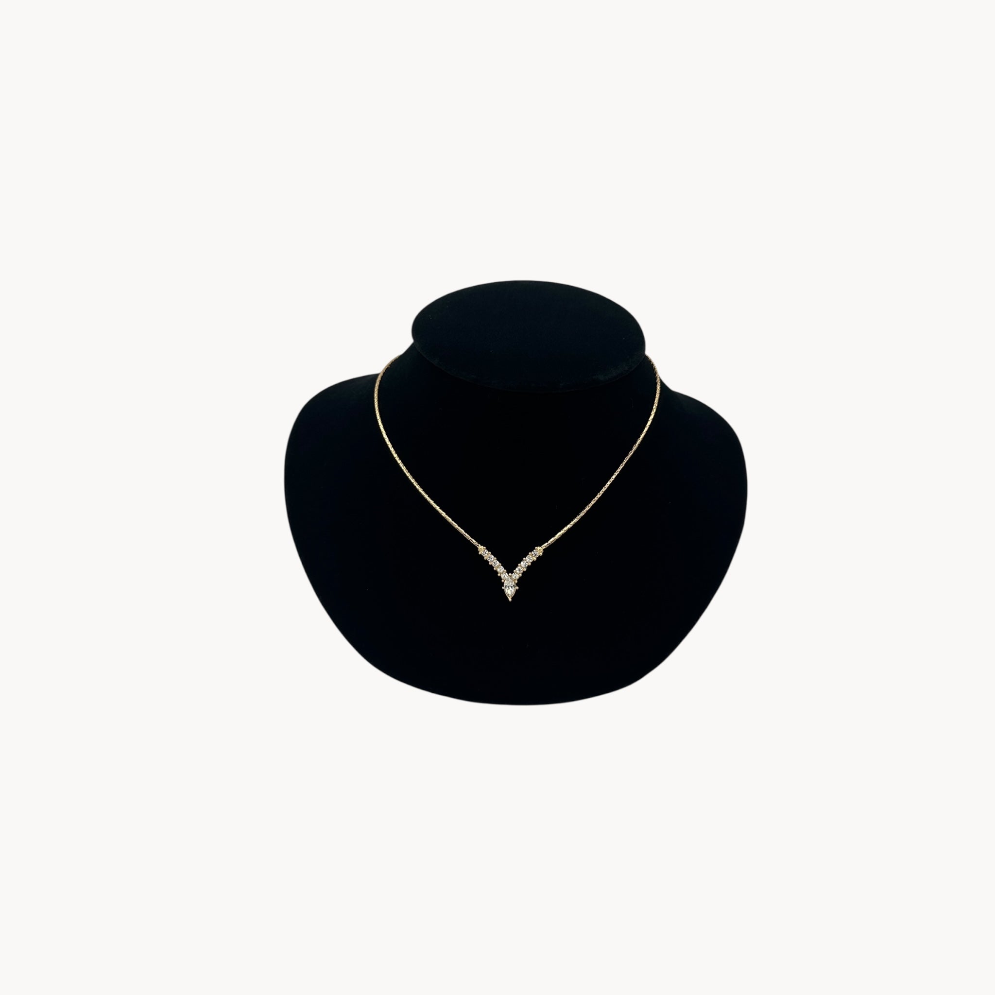 Vintage Christian Dior necklace with gold-tone chain and V-shaped crystal pendant, 1990s bridal jewelry.
