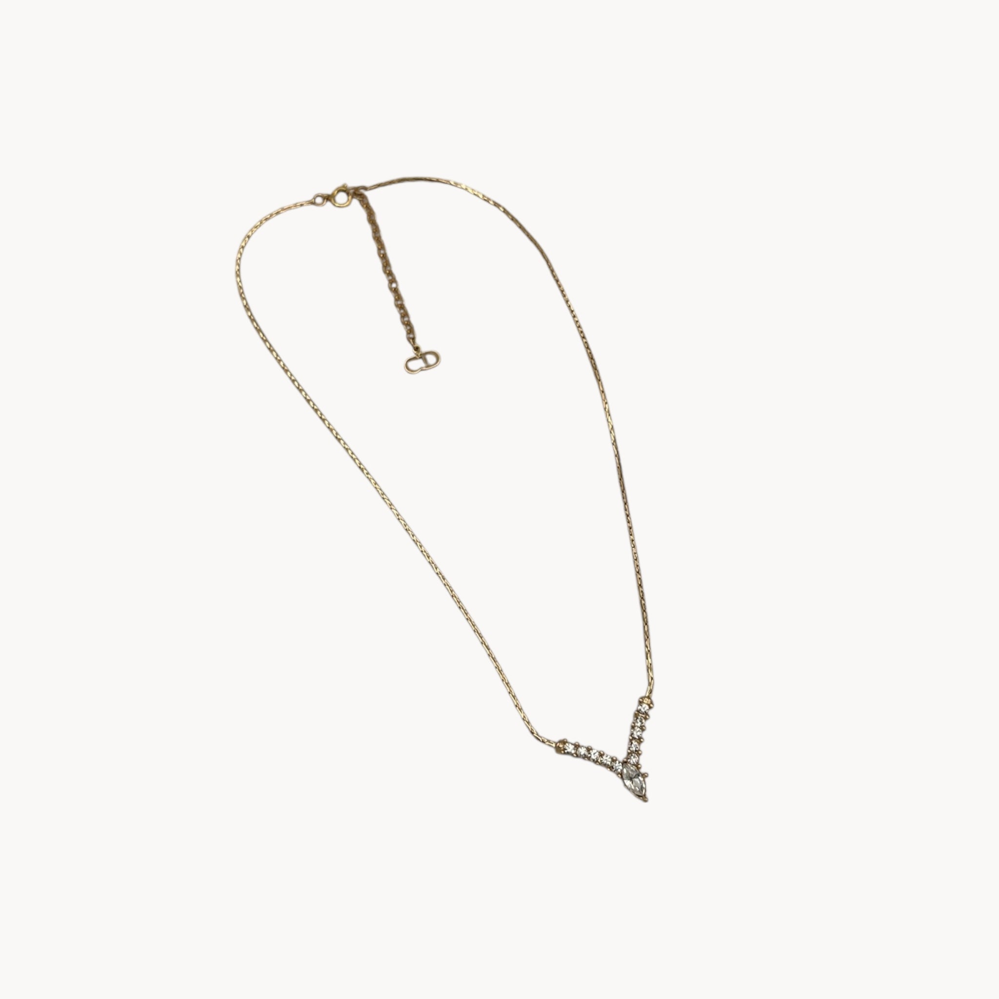 Full view Vintage Christian Dior necklace with gold-tone chain and V-shaped crystal pendant, 1990s bridal jewelry.