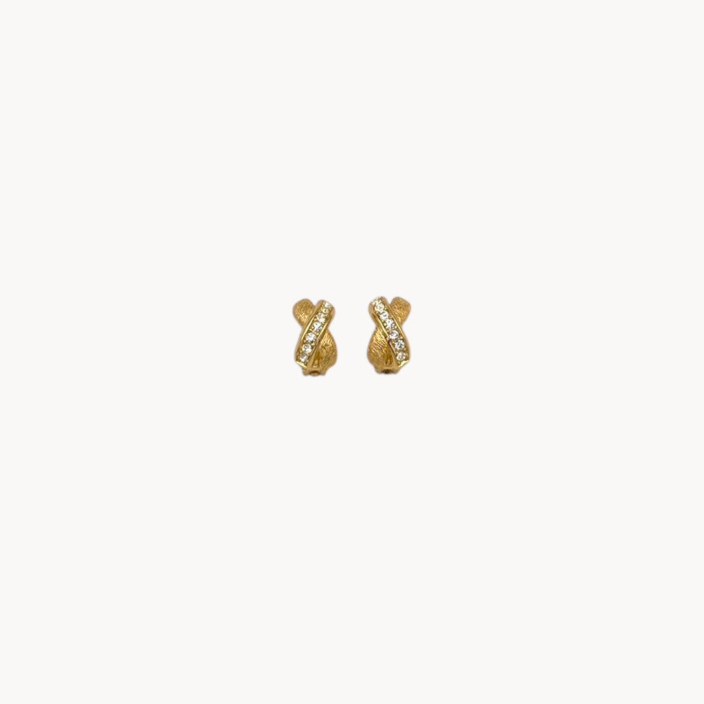 Vintage Christian Dior petite gold-tone clip-on earrings with rhinestone ribbon detail.