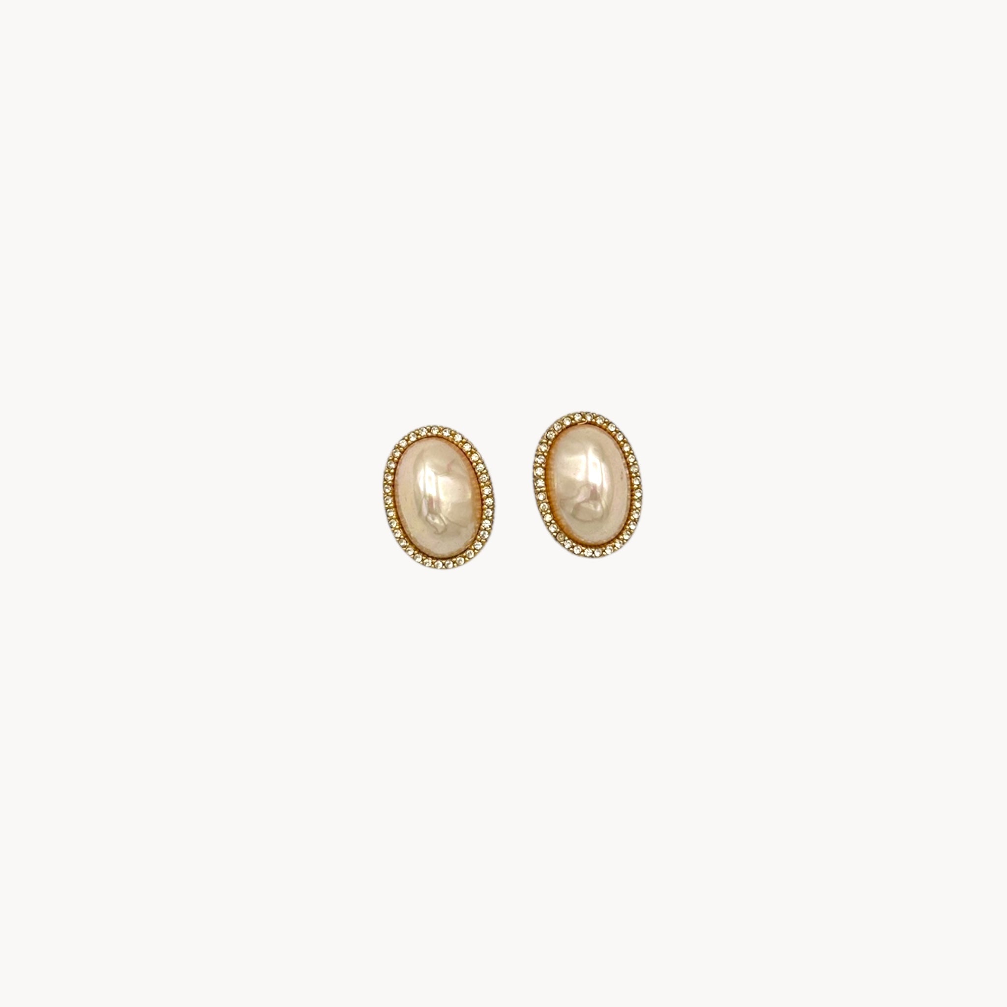 Vintage Ciner faux pearl clip-on earrings with rhinestone halo