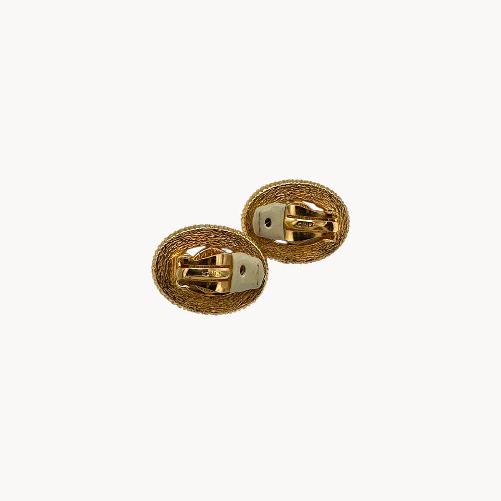 Back view of Vintage Ciner faux pearl clip-on earrings with rhinestone halo