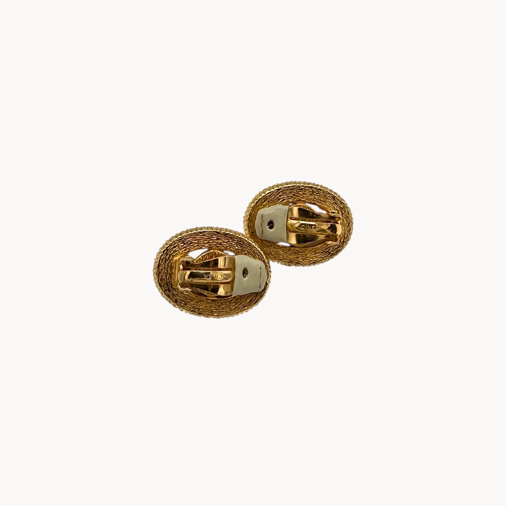 Back view of Vintage Ciner faux pearl clip-on earrings with rhinestone halo
