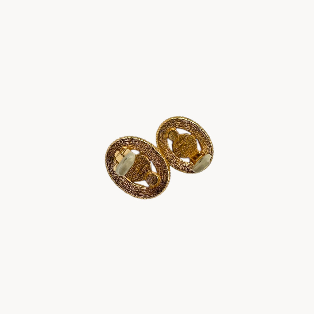 Back view with clips up of Vintage Ciner faux pearl clip-on earrings with rhinestone halo