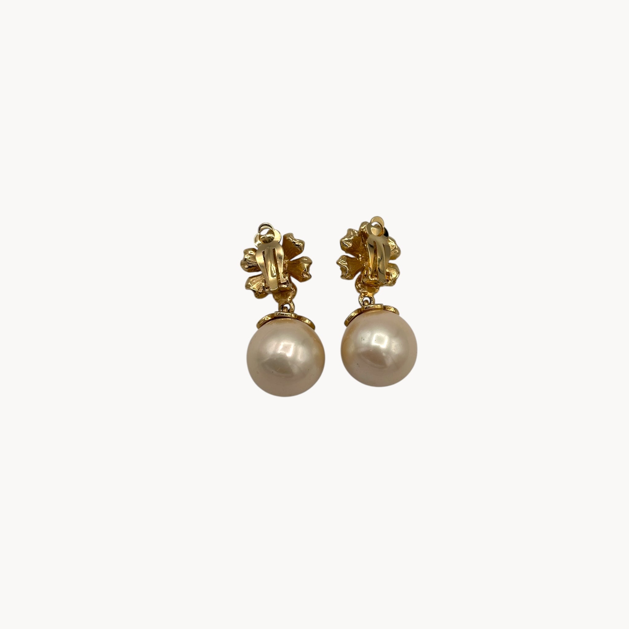 Back view Vintage unmarked clip-on earrings with crystal floral tops and faux pearl drops, 1990s bridal jewelry.