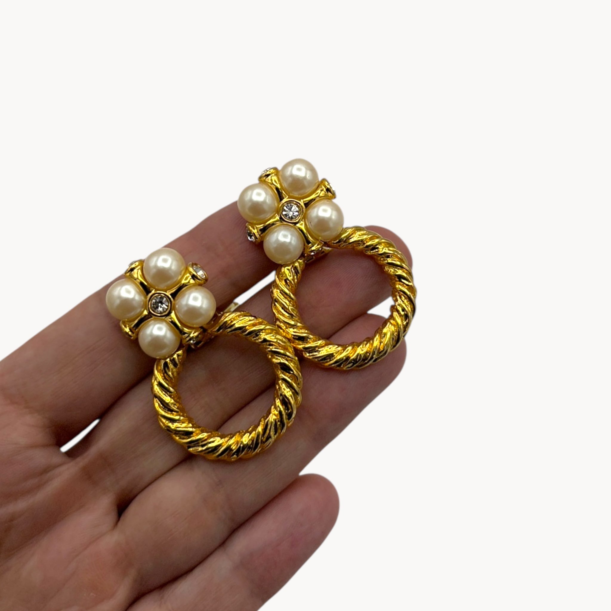 Scale size view Vintage unmarked gold door knocker clip-on earrings with faux pearl clusters and crystal accents, 1980s–1990s bridal statement jewelry.