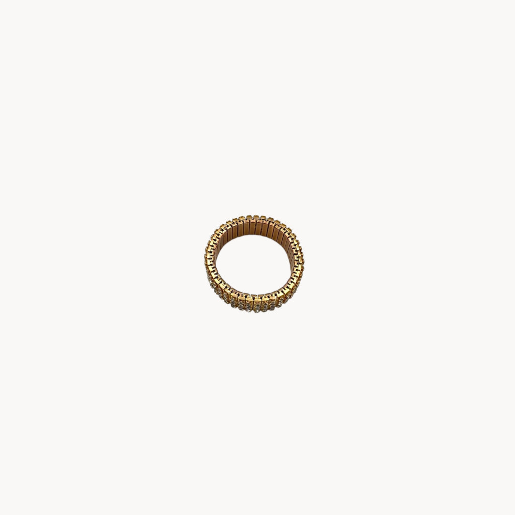 Top view of Vintage gold-tone expansion bracelet with three rows of rhinestones, mid-century design.