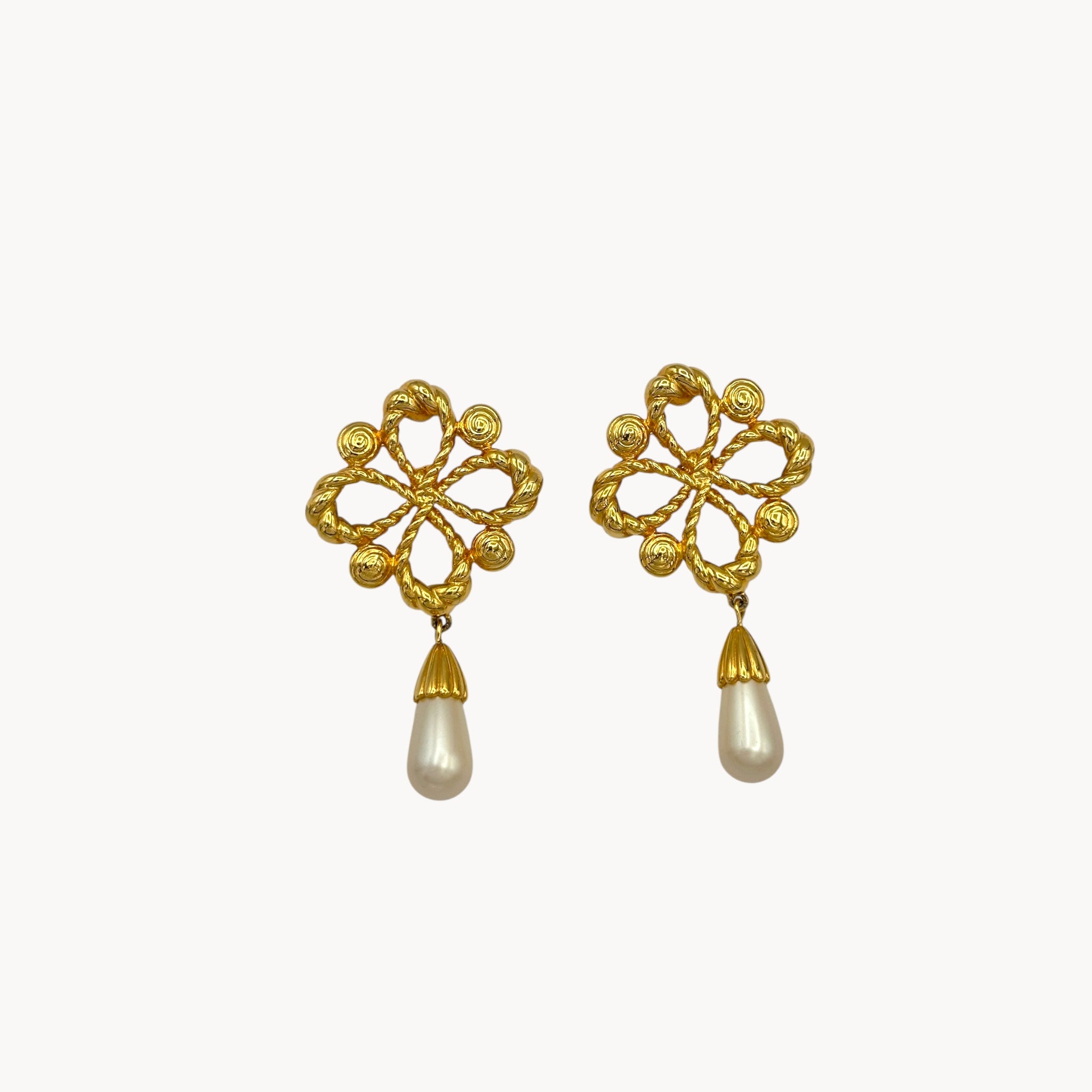 close up view Vintage Joan Rivers clip-on earrings with gold filigree design and faux pearl drops, 1990s bridal jewelry.