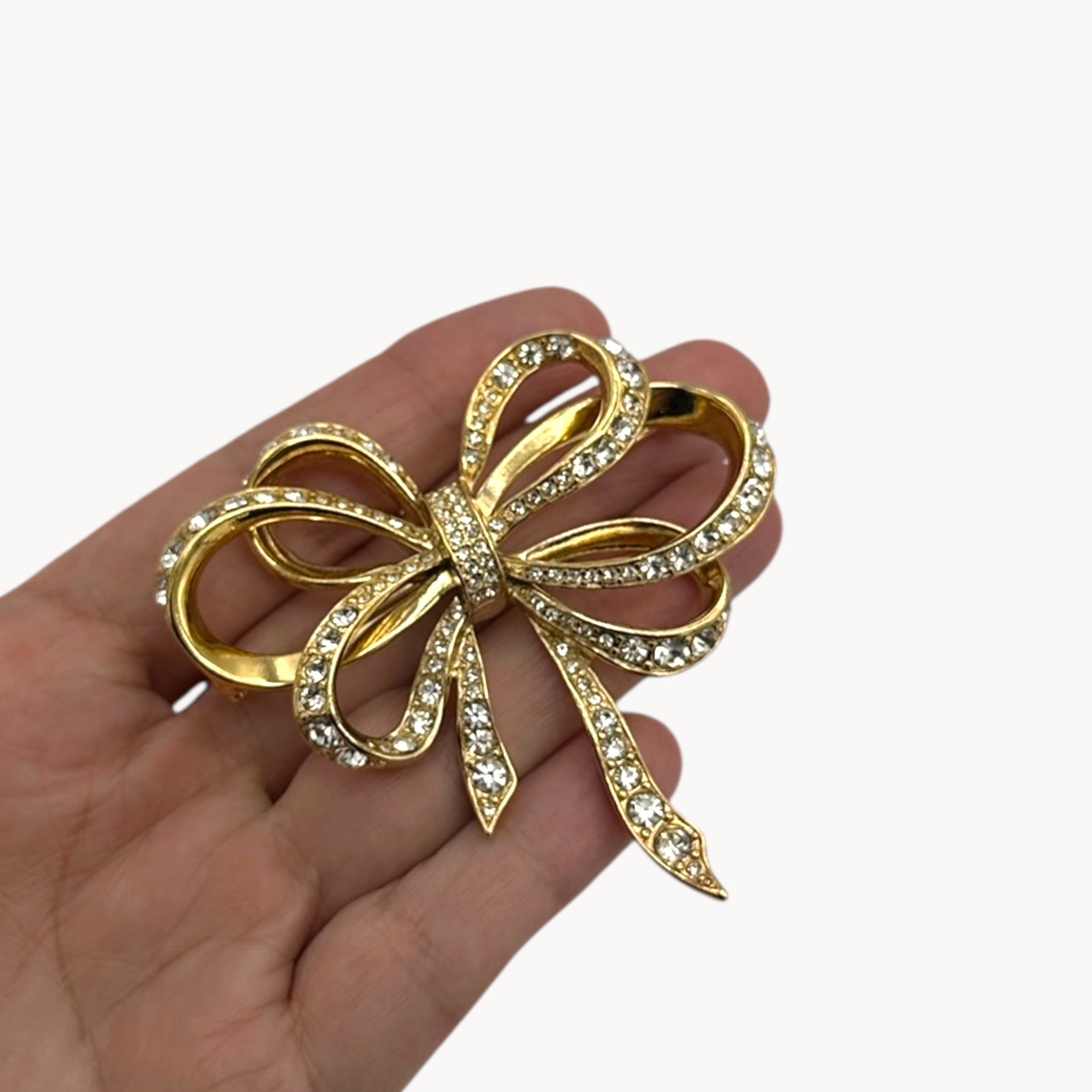 Vintage Kenneth Jay Lane gold and crystal pavé bow brooch