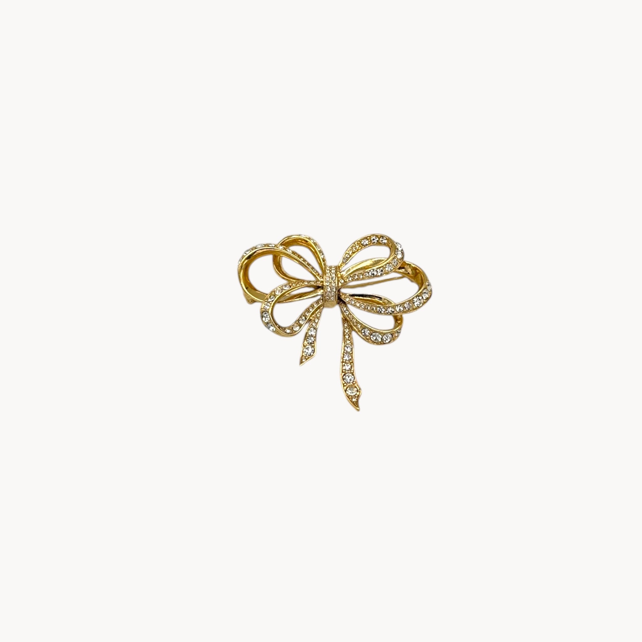 Vintage Kenneth Jay Lane gold and crystal pavé bow brooch