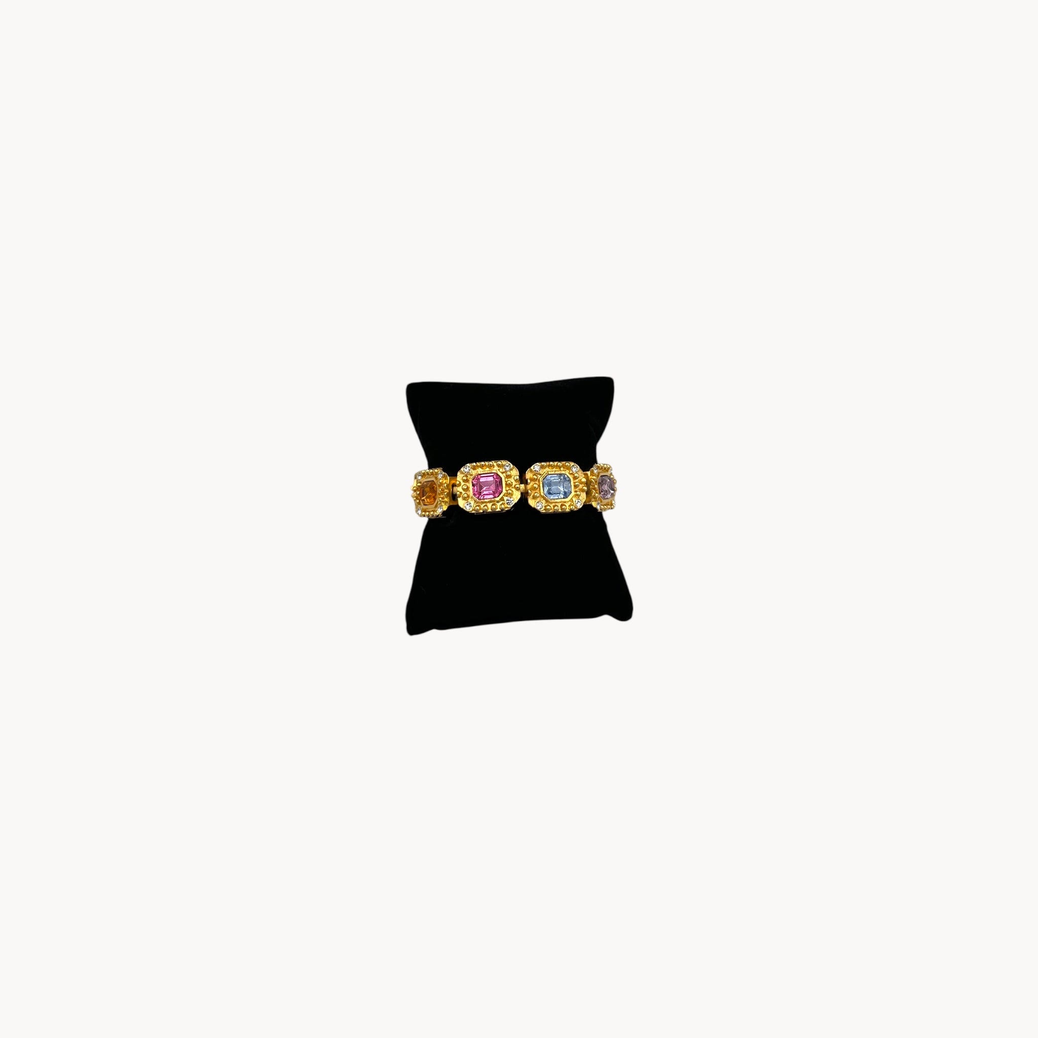 Vintage Kenneth Jay Lane bracelet with multicolor emerald-cut rhinestones framed in gold-tone and pavé crystals, 1980s–1990s statement jewelry.