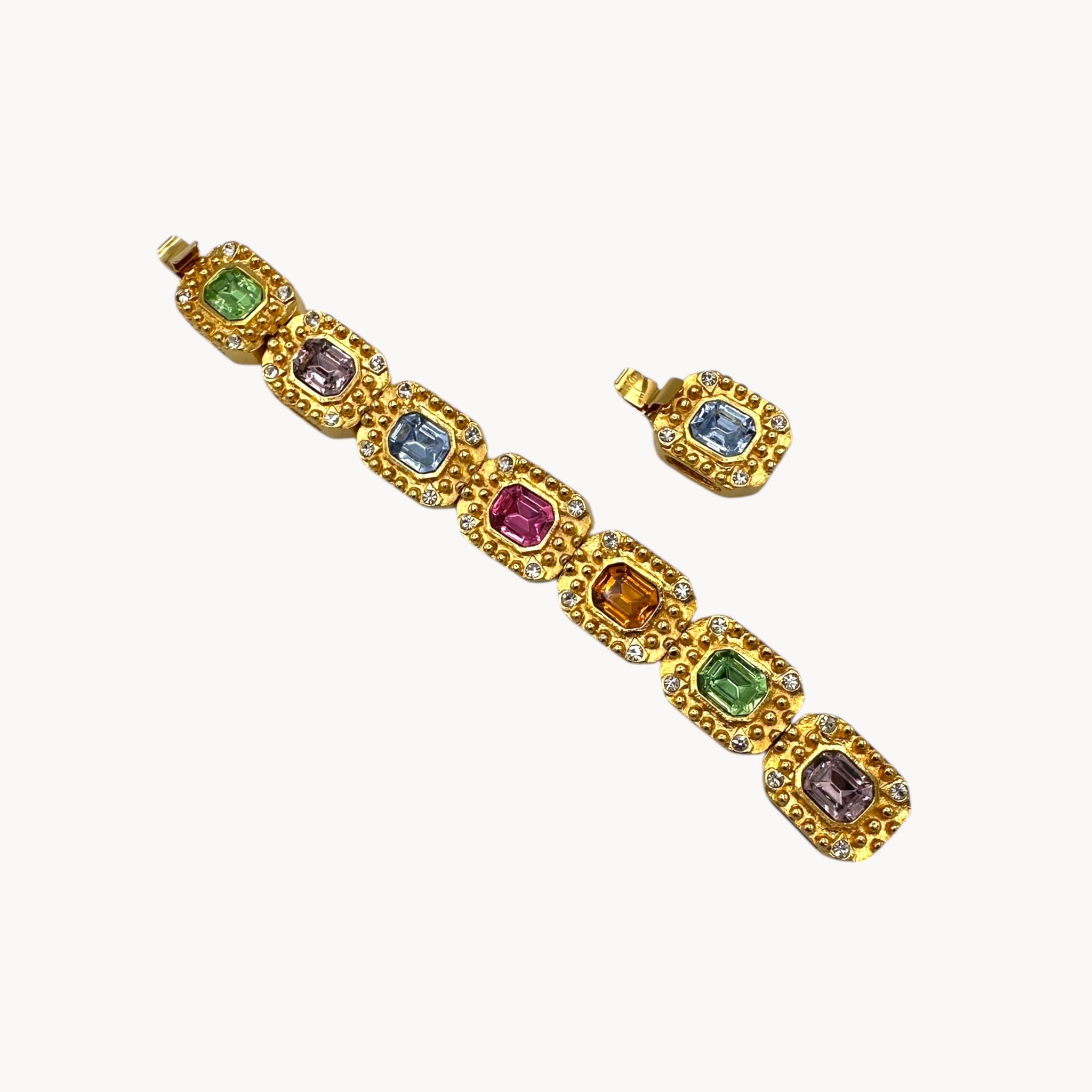 Extra link view Vintage Kenneth Jay Lane bracelet with multicolor emerald-cut rhinestones framed in gold-tone and pavé crystals, 1980s–1990s statement jewelry.