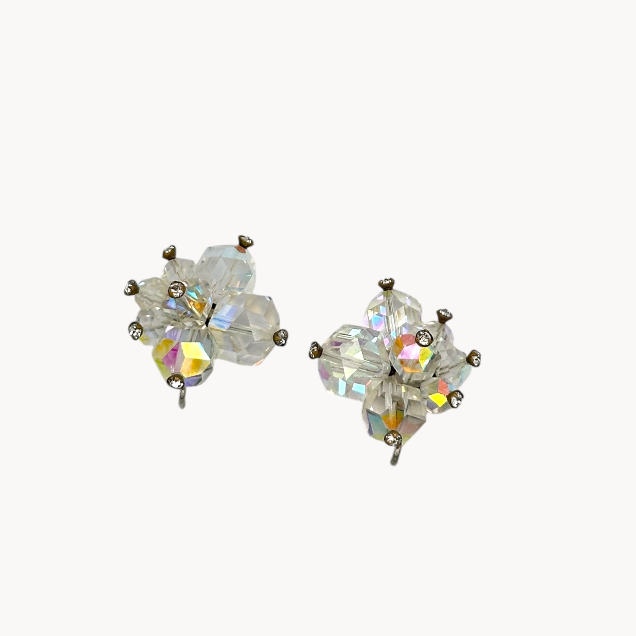 Close up viiew 1950s Laguna crystal cluster clip-on earrings with aurora borealis finish, vintage bridal jewelry