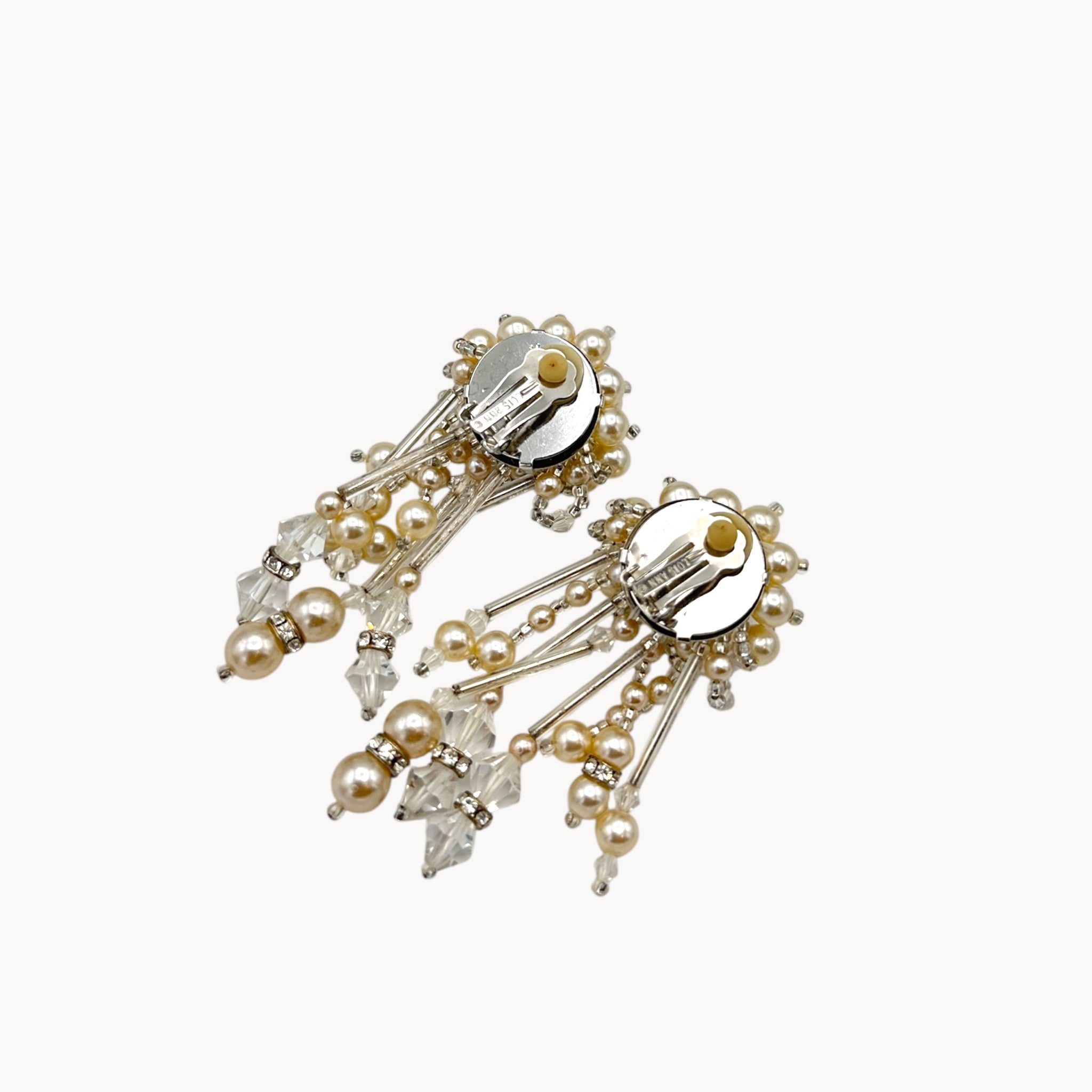 Back view of Vintage Lois Ann Pearl & Crystal Beaded Cascade Clip-On Earrings on white background.