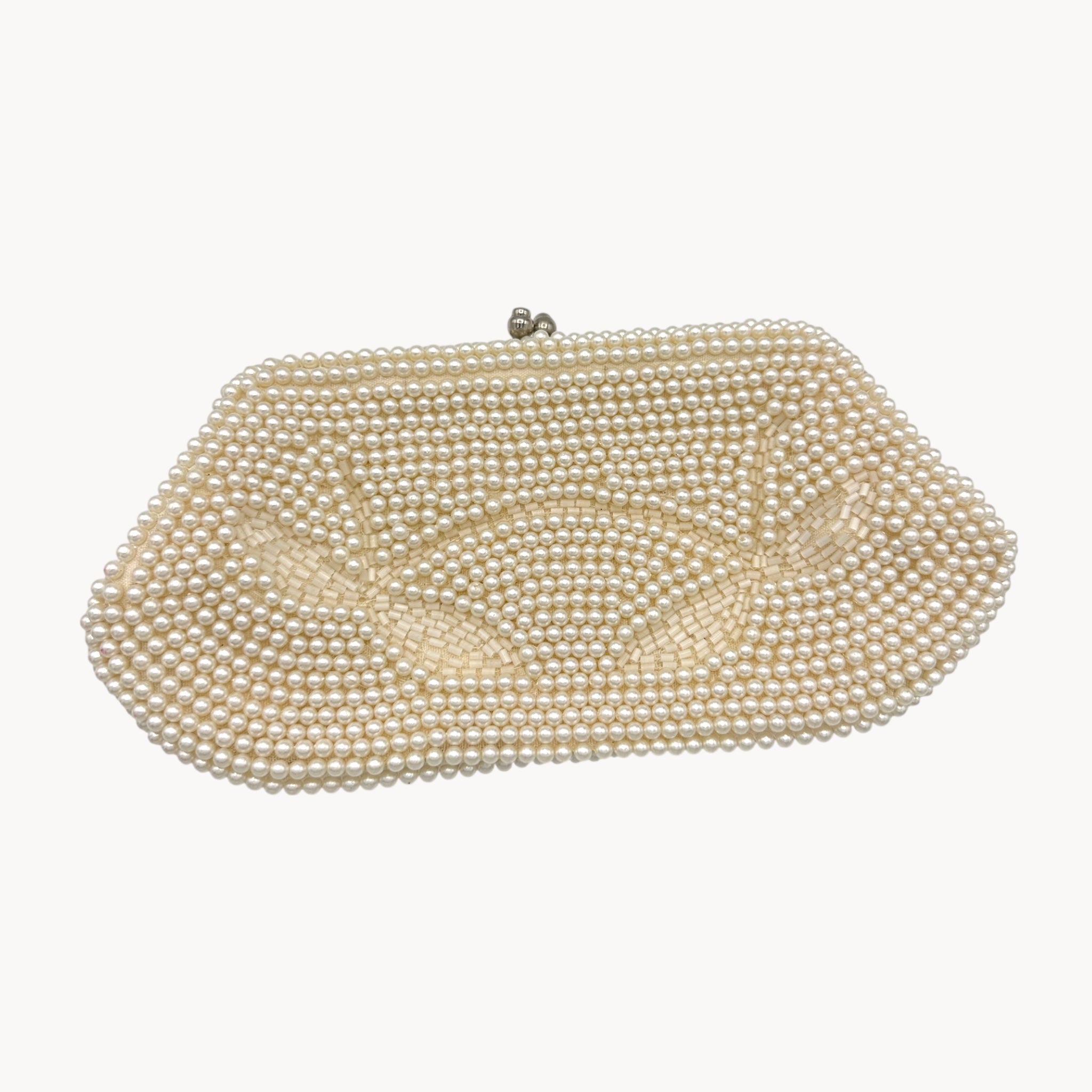 Close up view of front of Vintage Made in Japan small pearl beaded clutch handbag, 1950 bridal purse on white background.
