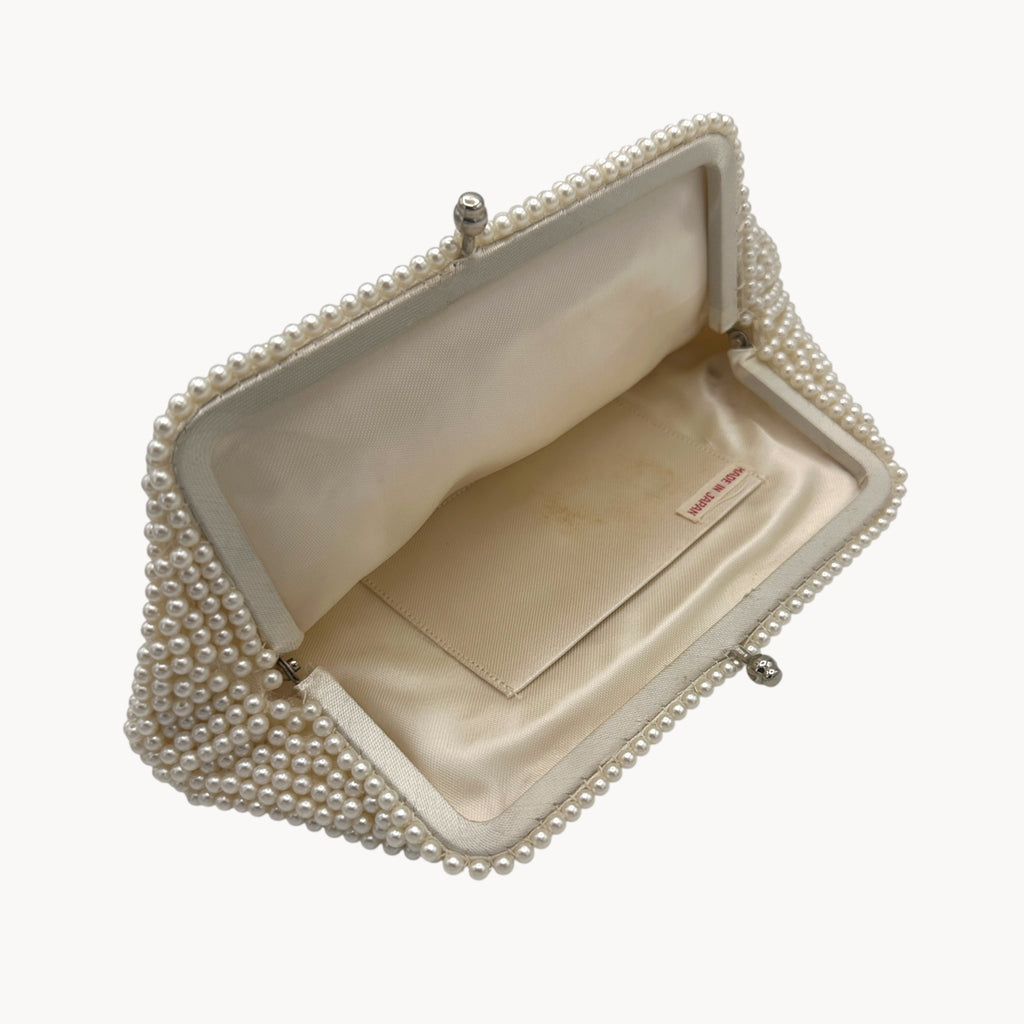 Closer open view of Vintage Made in Japan small pearl beaded clutch handbag, 1950 bridal purse on white background.