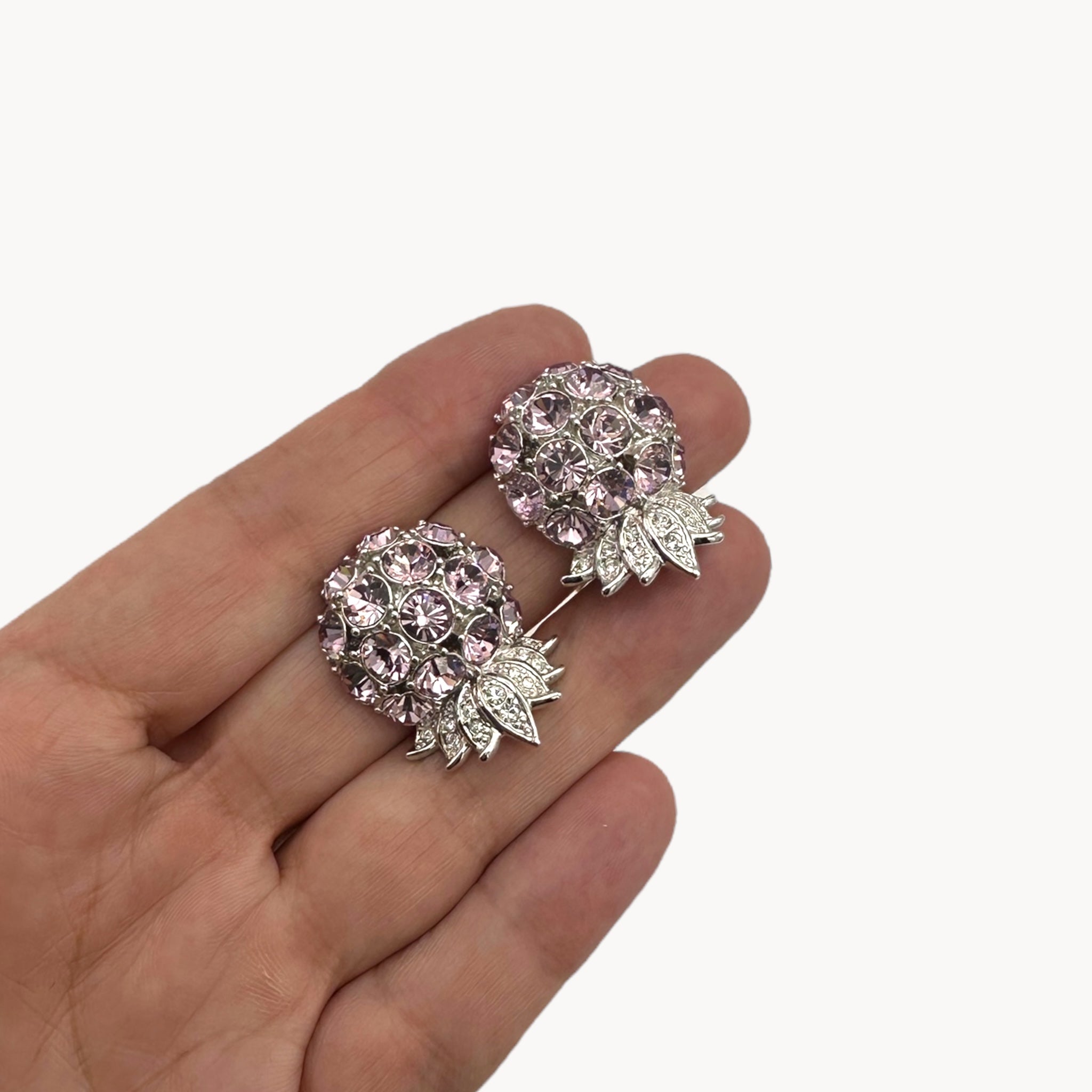 Size view of Nolan Miller statement earrings.
