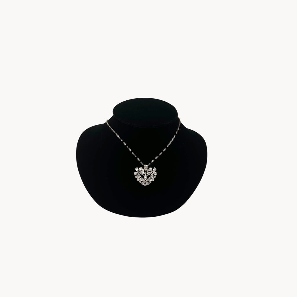 Vintage Nolan Miller rhinestone heart pendant necklace on silver chain.