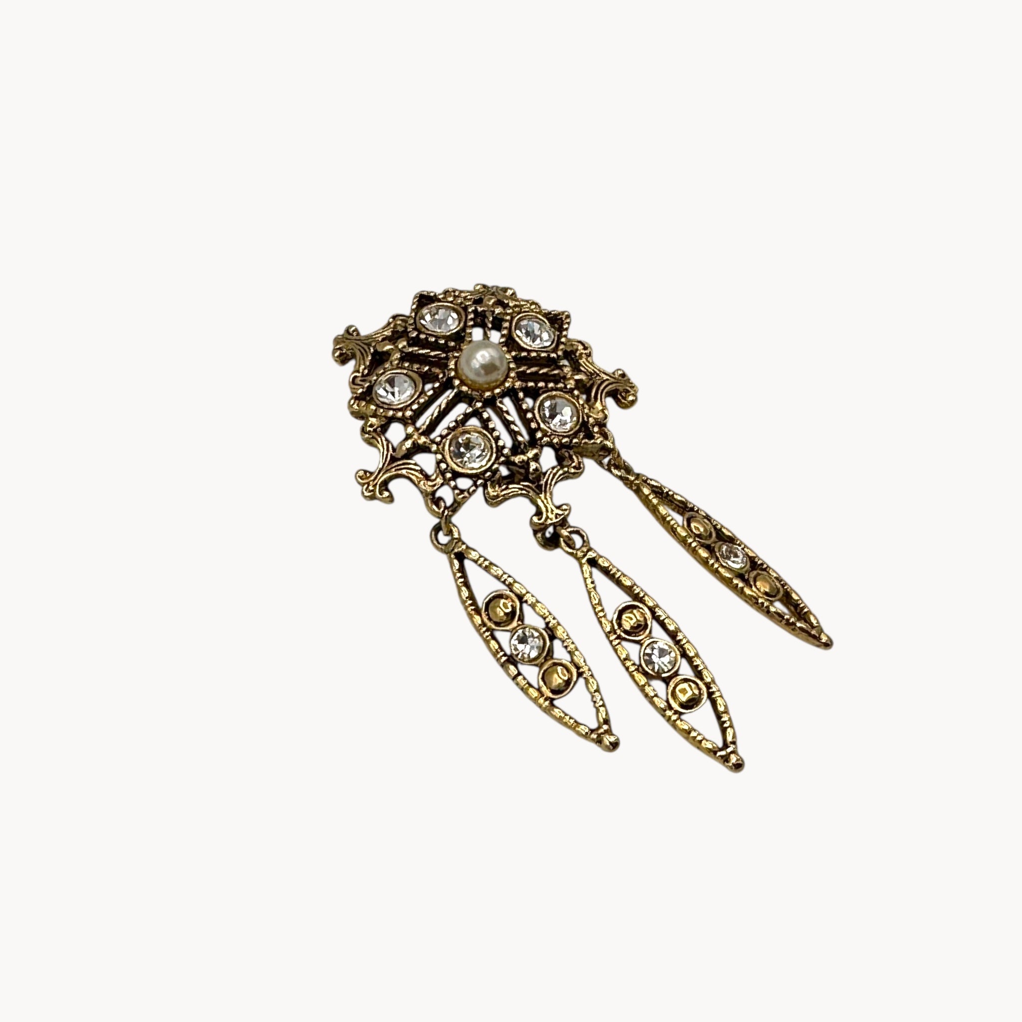 Side view of Vintage pearl and rhinestone drop brooch with three dangles in Victorian revival style