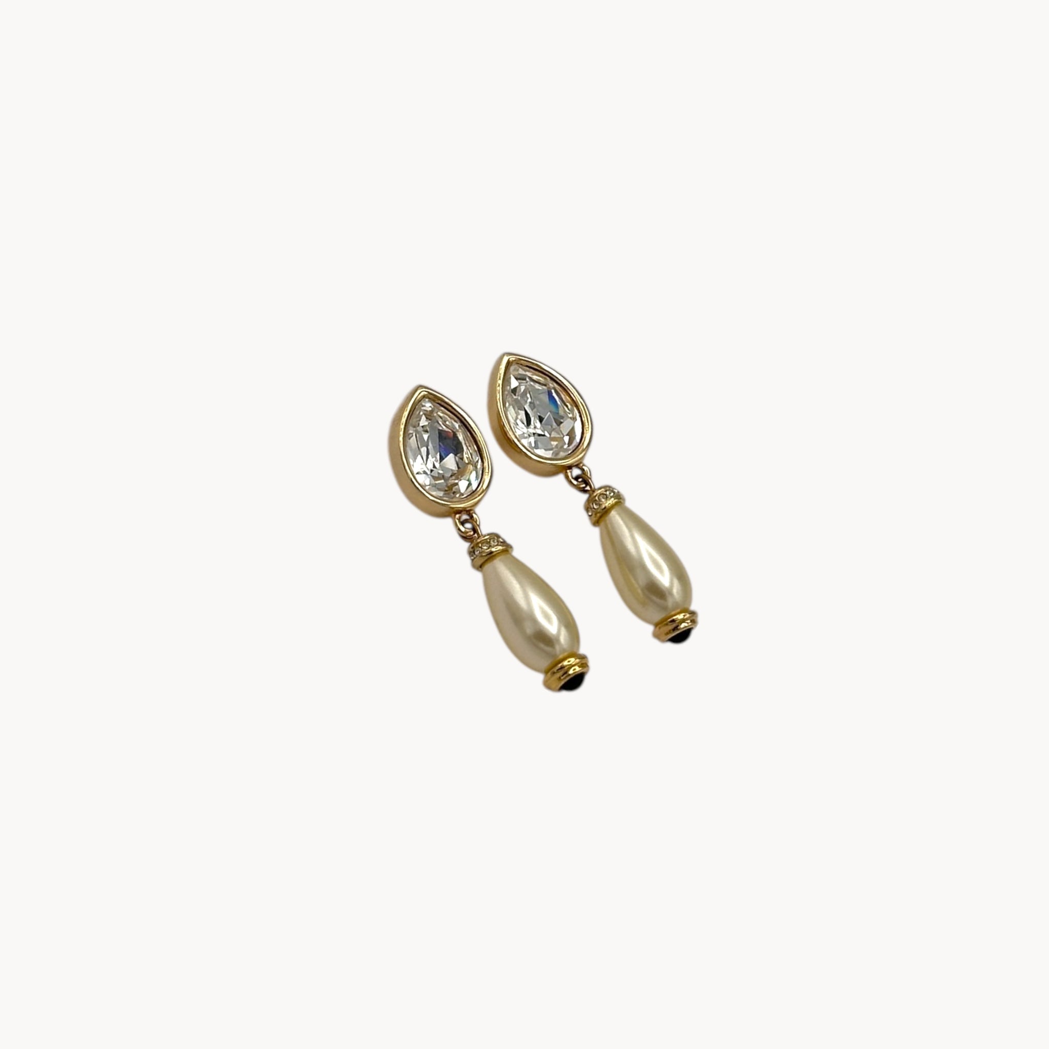 Side view of Swarovski Crystal & Faux Pearl Drop Pierced Earrings on white background.